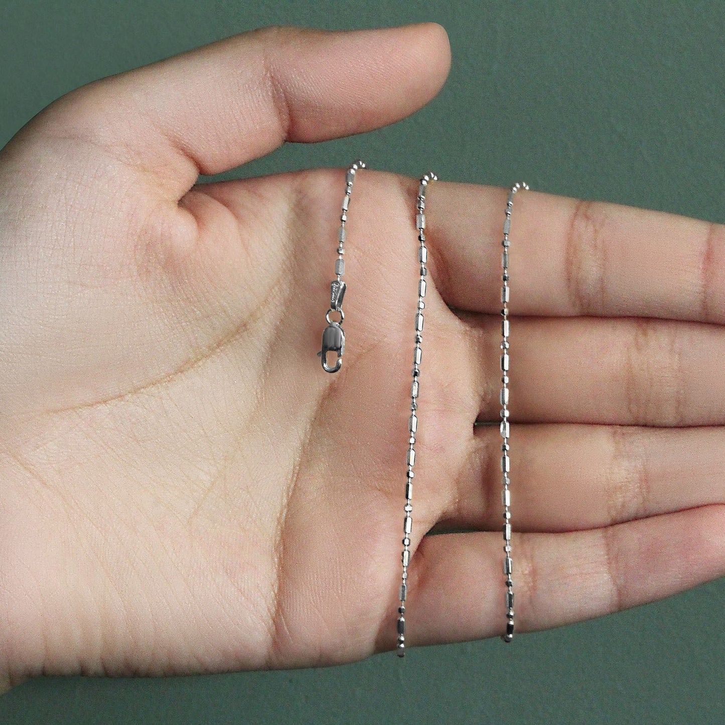 Peelerie jewelry piece in midnight luxury editorial product photo, high-contrast studio lighting