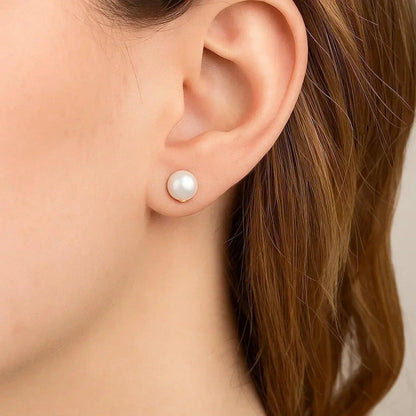 14k yellow and white gold stud earrings set with pearl