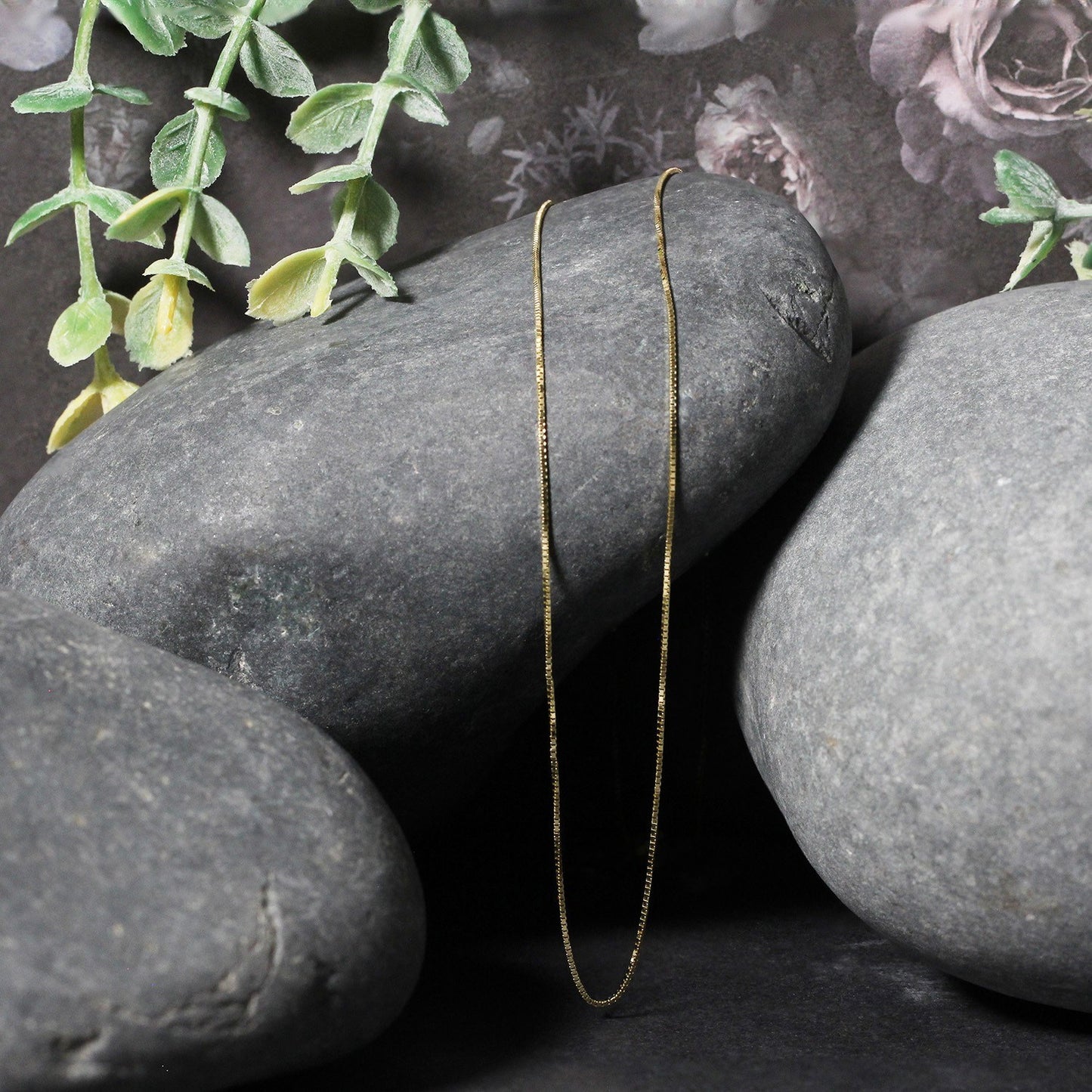 Peelerie jewelry piece in gold midnight luxury editorial product photo, high-contrast studio lighting