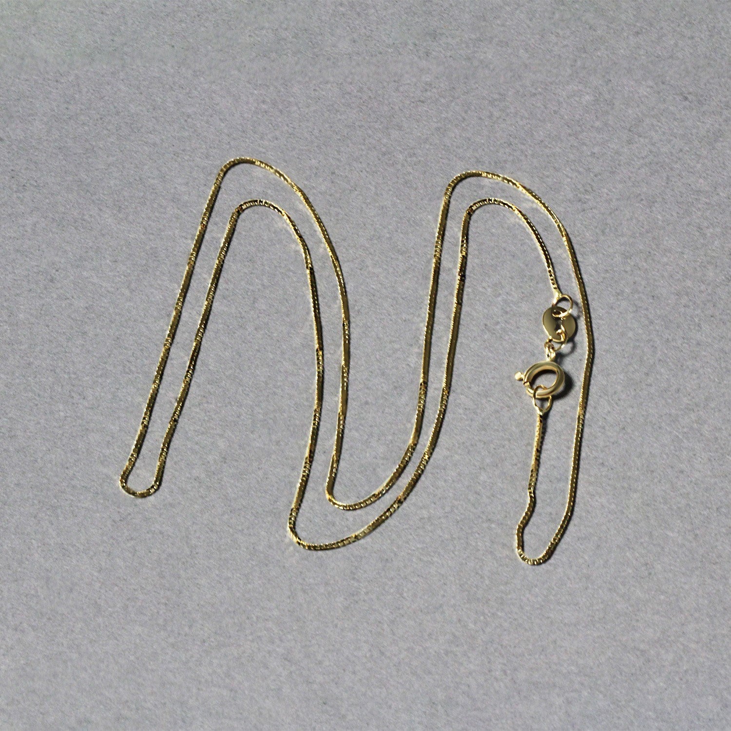 Peelerie jewelry piece in midnight luxury editorial product photo, high-contrast studio lighting