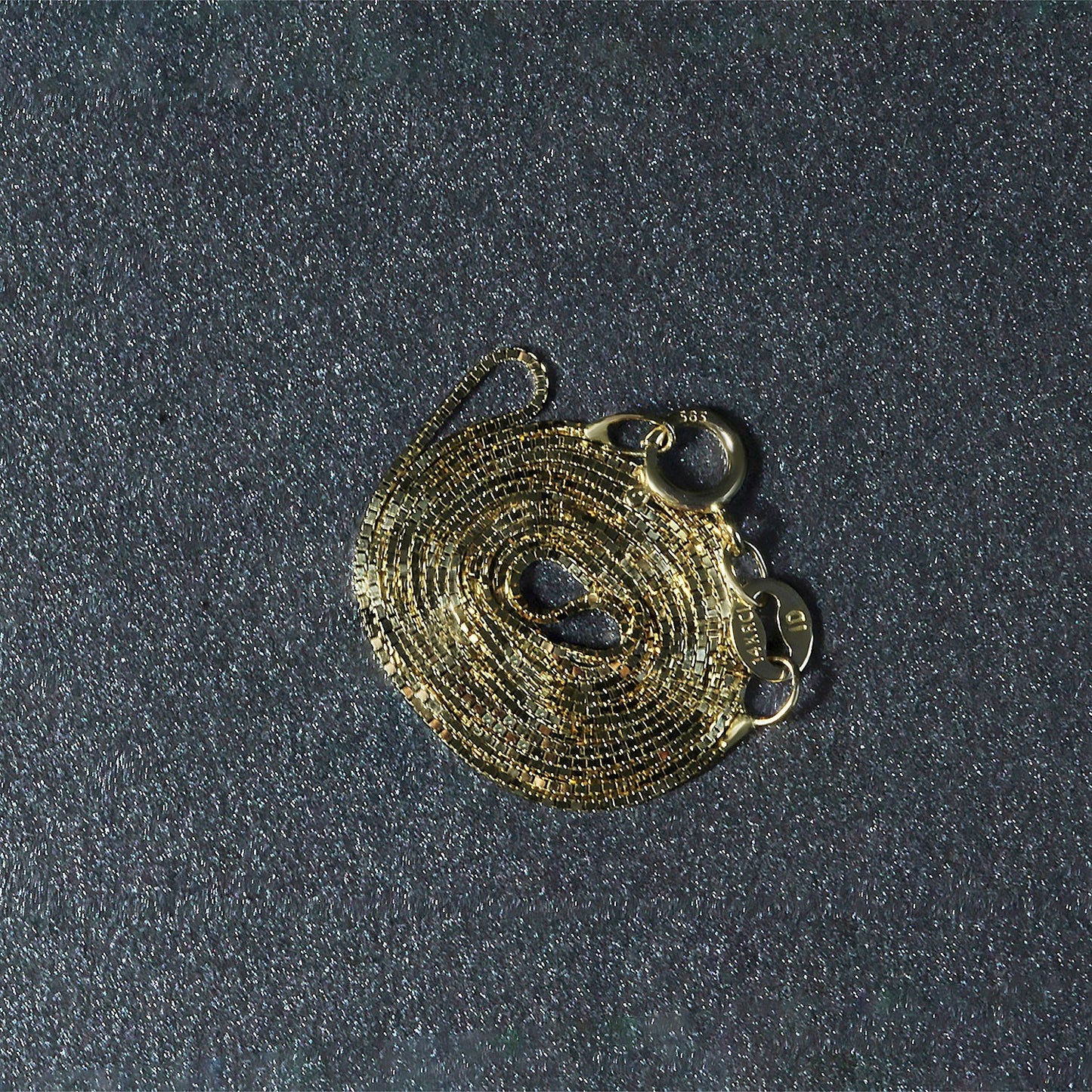 Peelerie jewelry piece in midnight luxury editorial product photo, high-contrast studio lighting