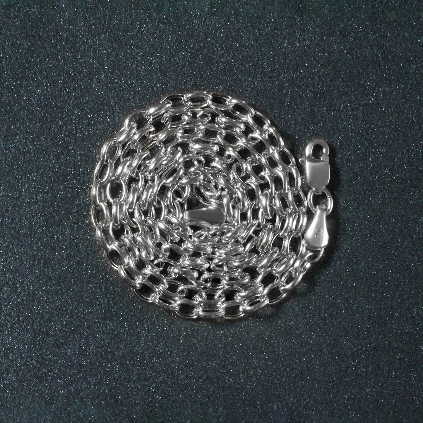 Peelerie jewelry piece in midnight luxury editorial product photo, high-contrast studio lighting