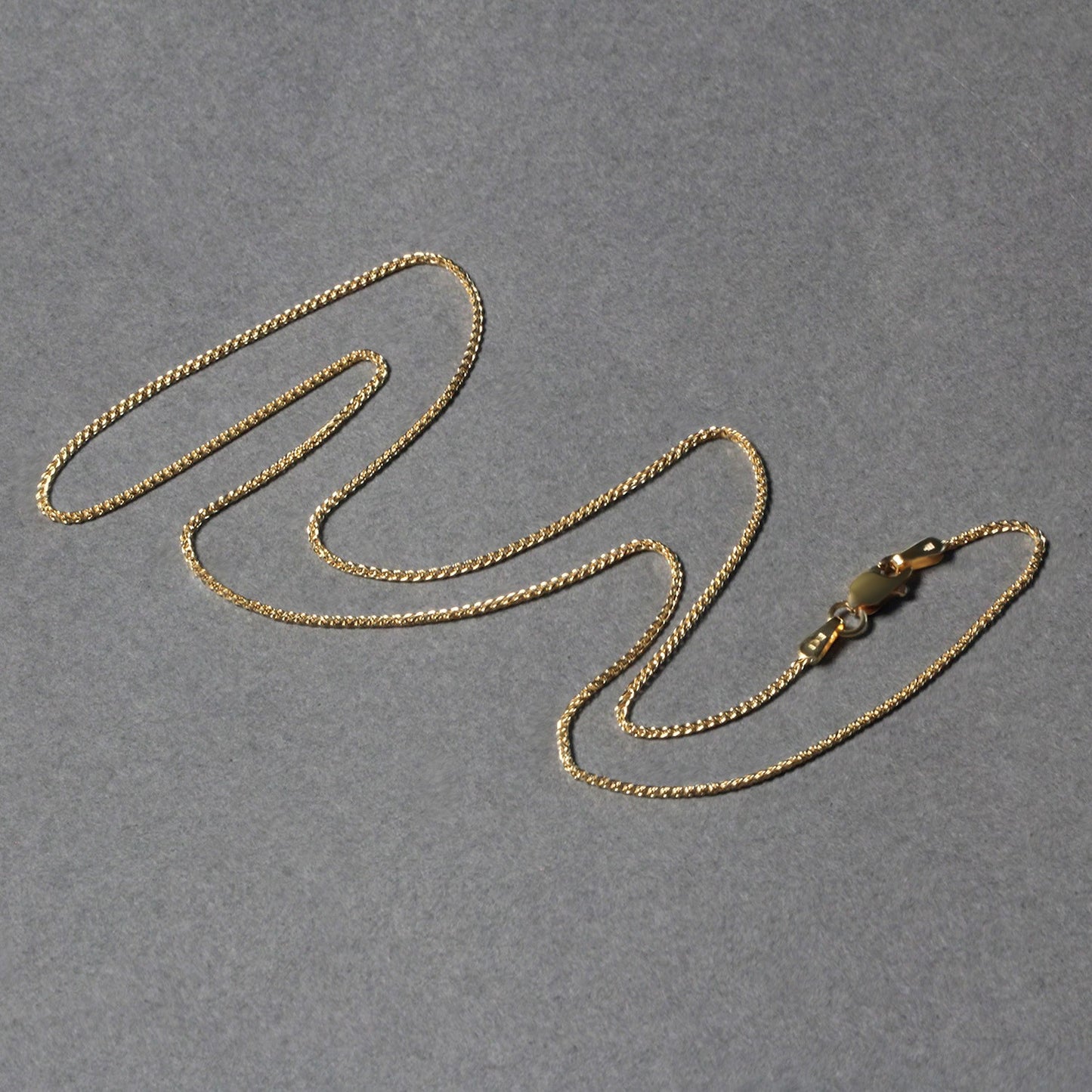 Peelerie jewelry piece in midnight luxury editorial product photo, high-contrast studio lighting