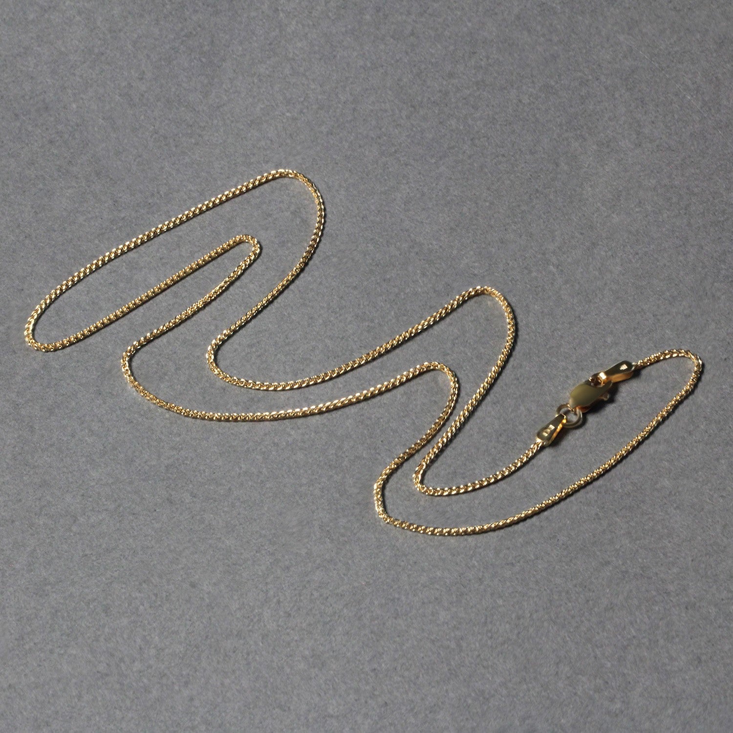 Peelerie jewelry piece in midnight luxury editorial product photo, high-contrast studio lighting