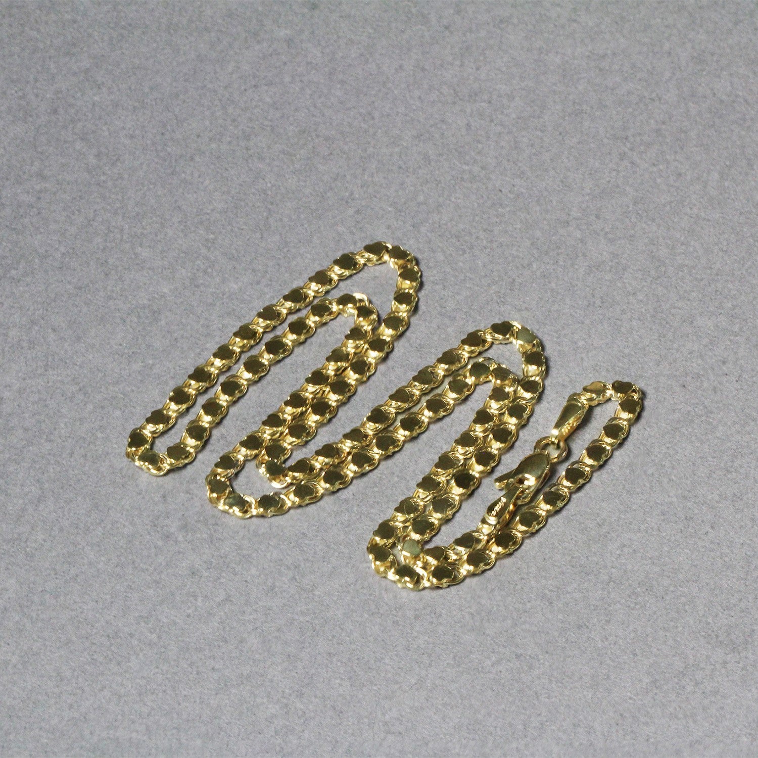 Peelerie jewelry piece in midnight luxury editorial product photo, high-contrast studio lighting