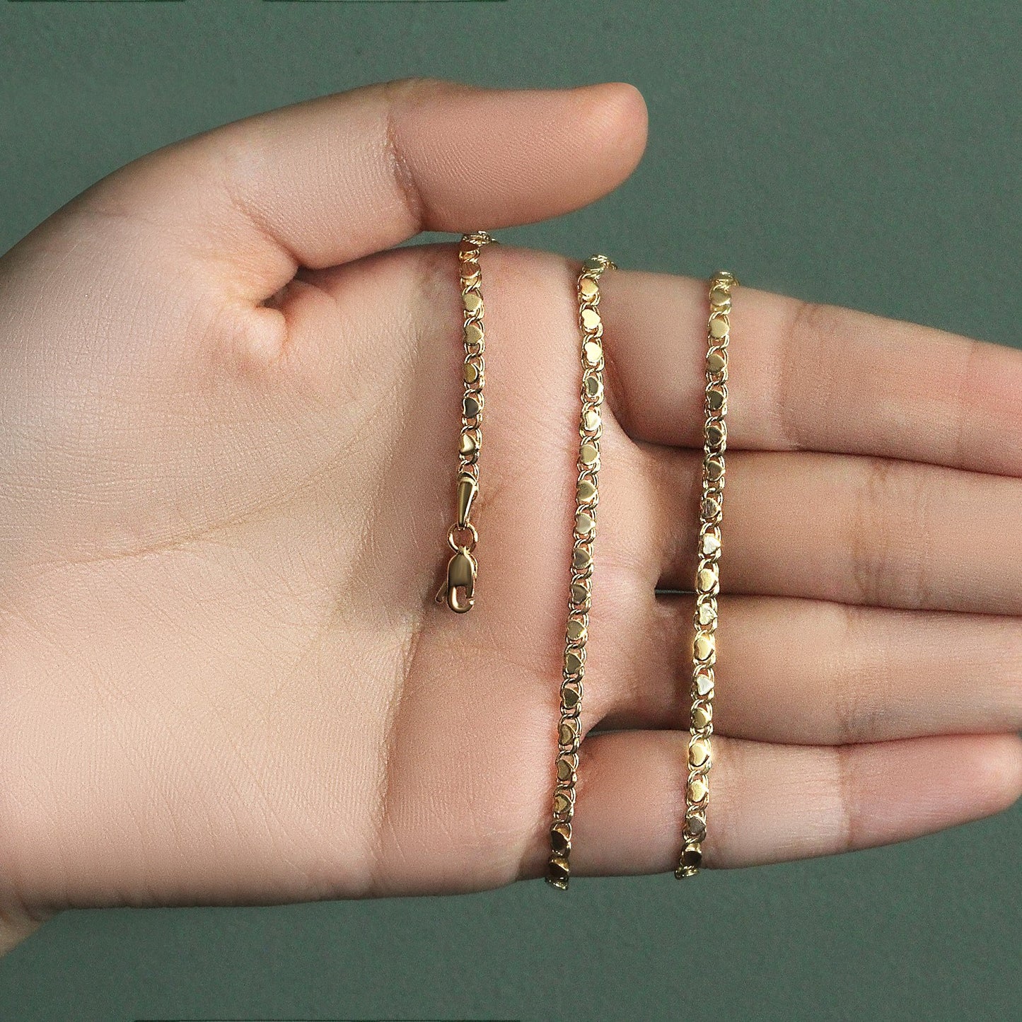 Peelerie jewelry piece in midnight luxury editorial product photo, high-contrast studio lighting