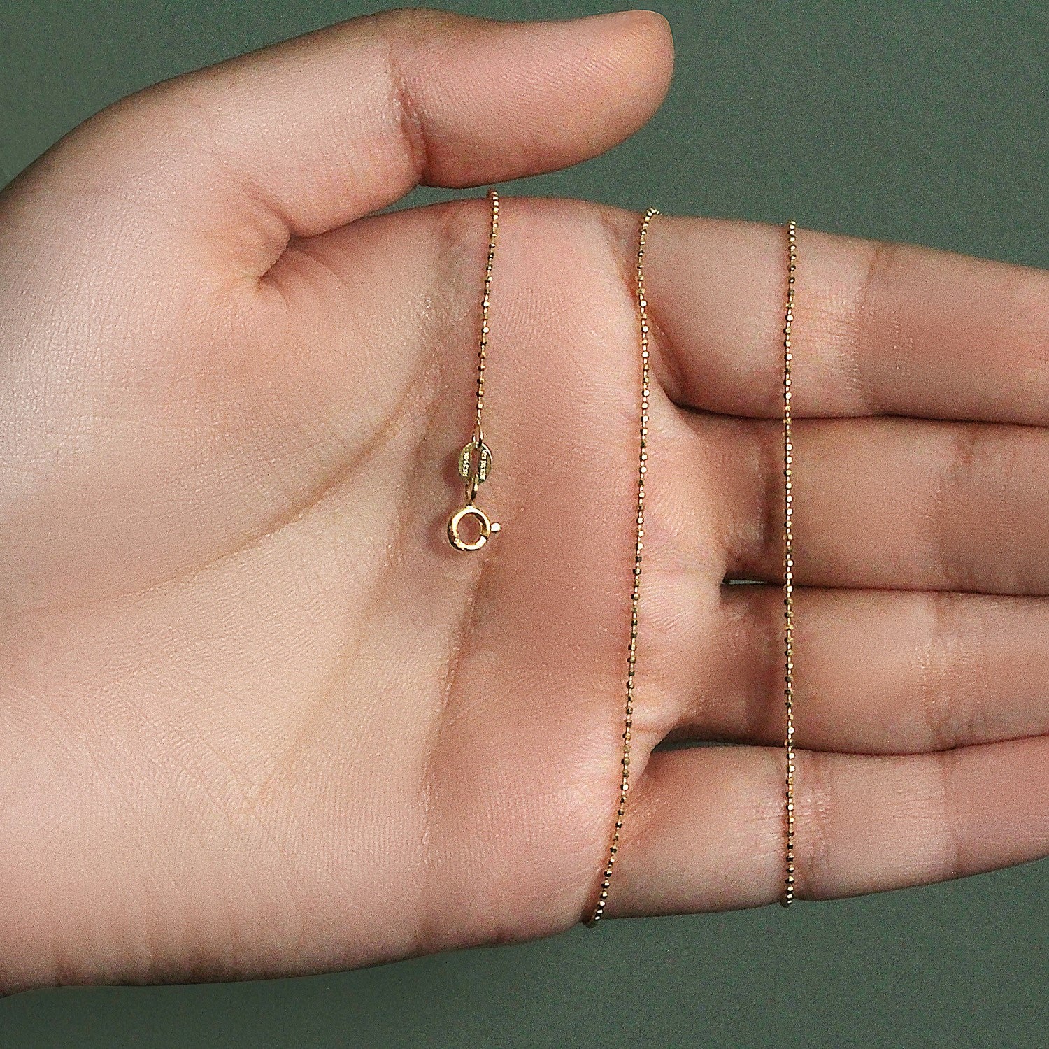 Peelerie jewelry piece in midnight luxury editorial product photo, high-contrast studio lighting