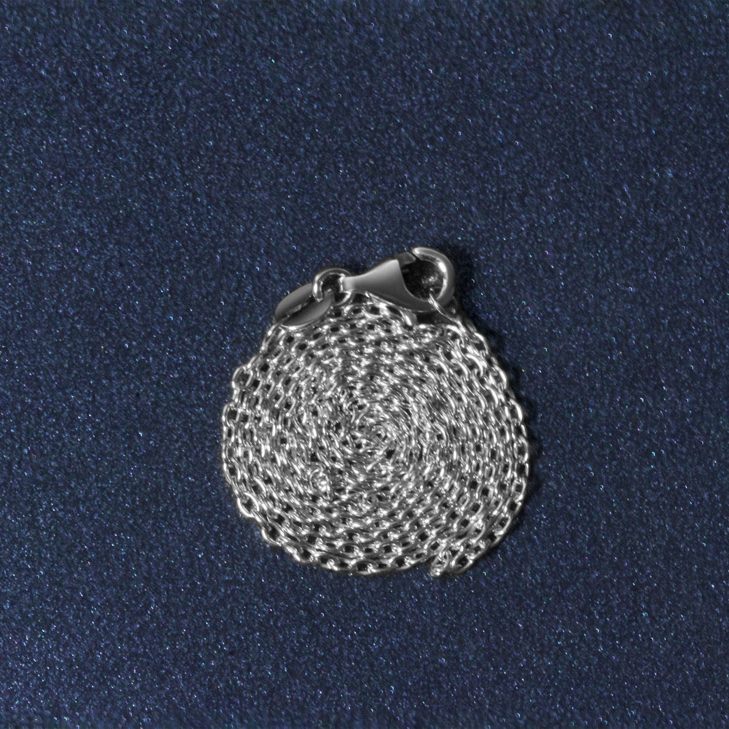 Peelerie jewelry piece in midnight luxury editorial product photo, high-contrast studio lighting