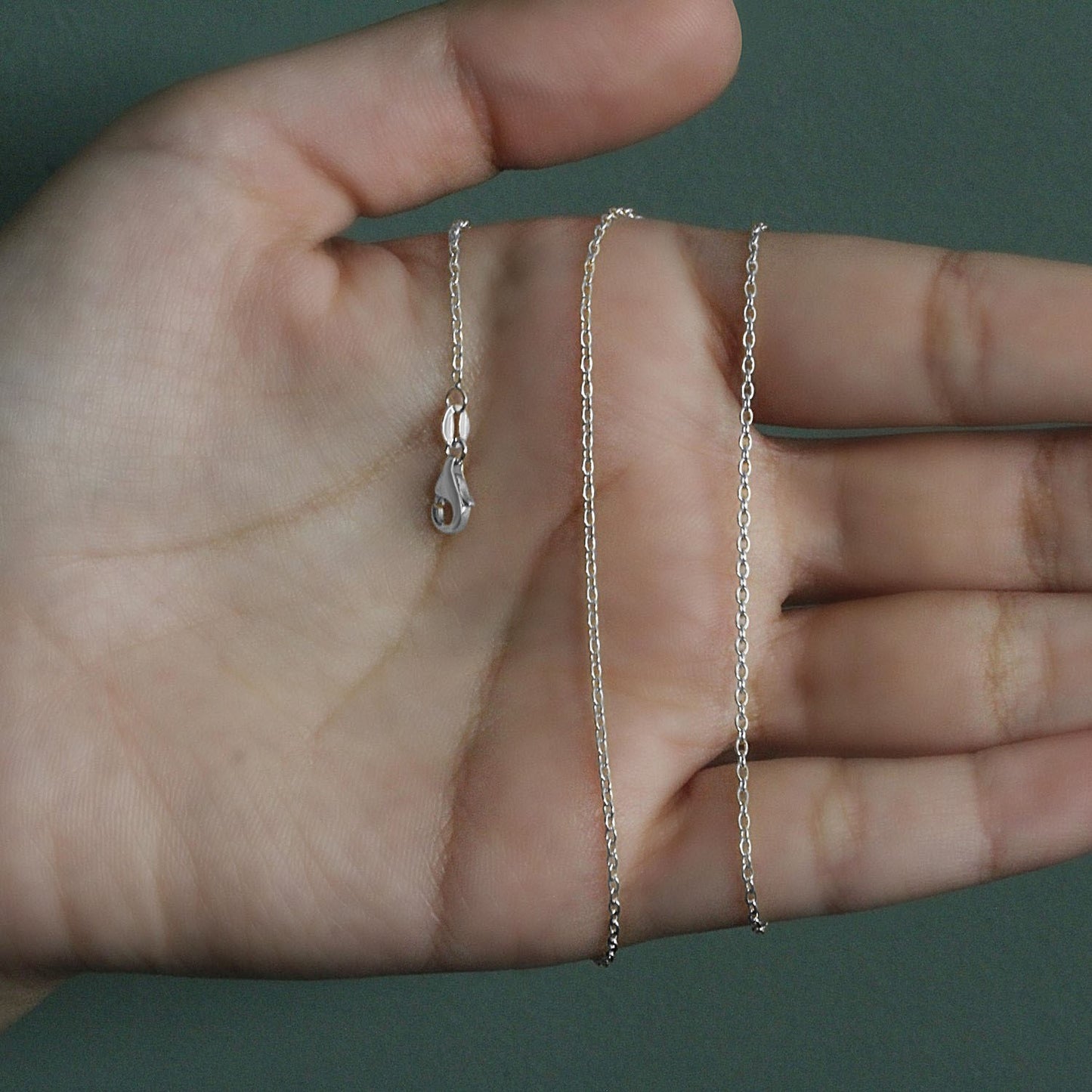 Peelerie jewelry piece in midnight luxury editorial product photo, high-contrast studio lighting