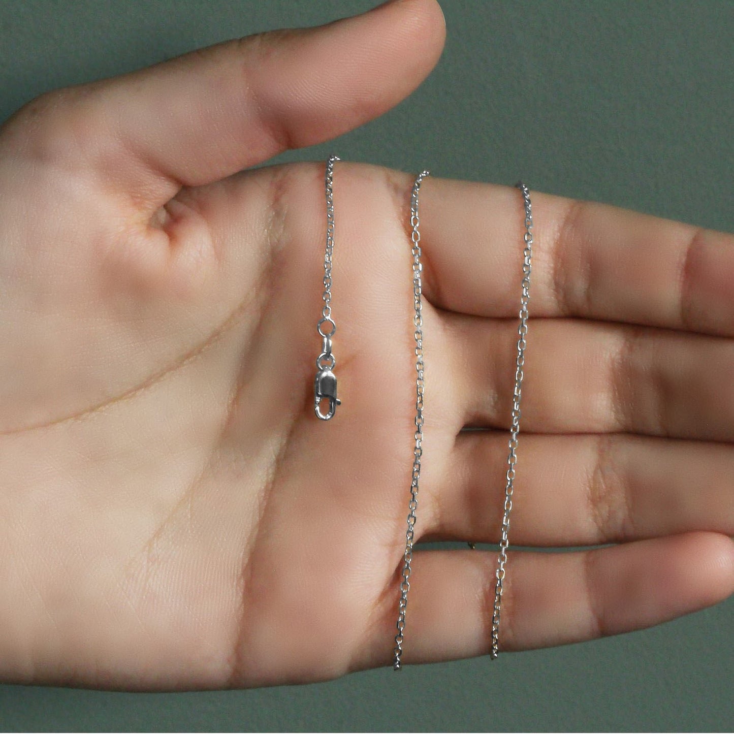 Peelerie jewelry piece in midnight luxury editorial product photo, high-contrast studio lighting