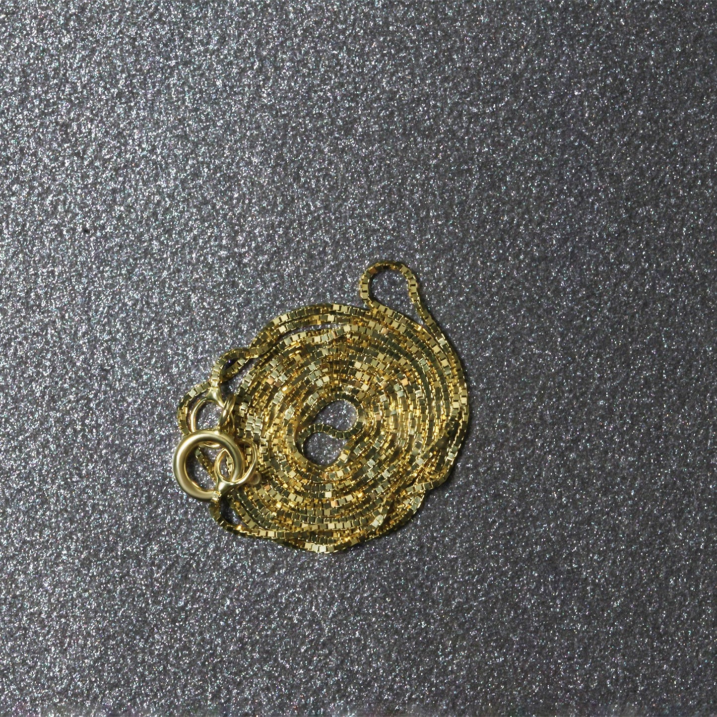 Peelerie jewelry piece in midnight luxury editorial product photo, high-contrast studio lighting