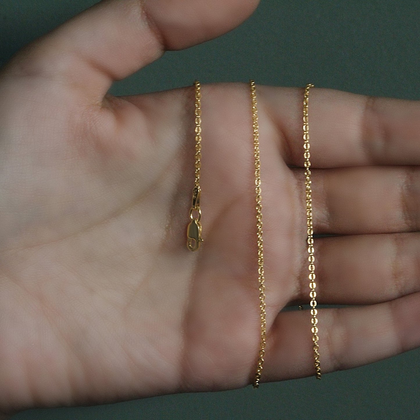 Peelerie jewelry piece in midnight luxury editorial product photo, high-contrast studio lighting