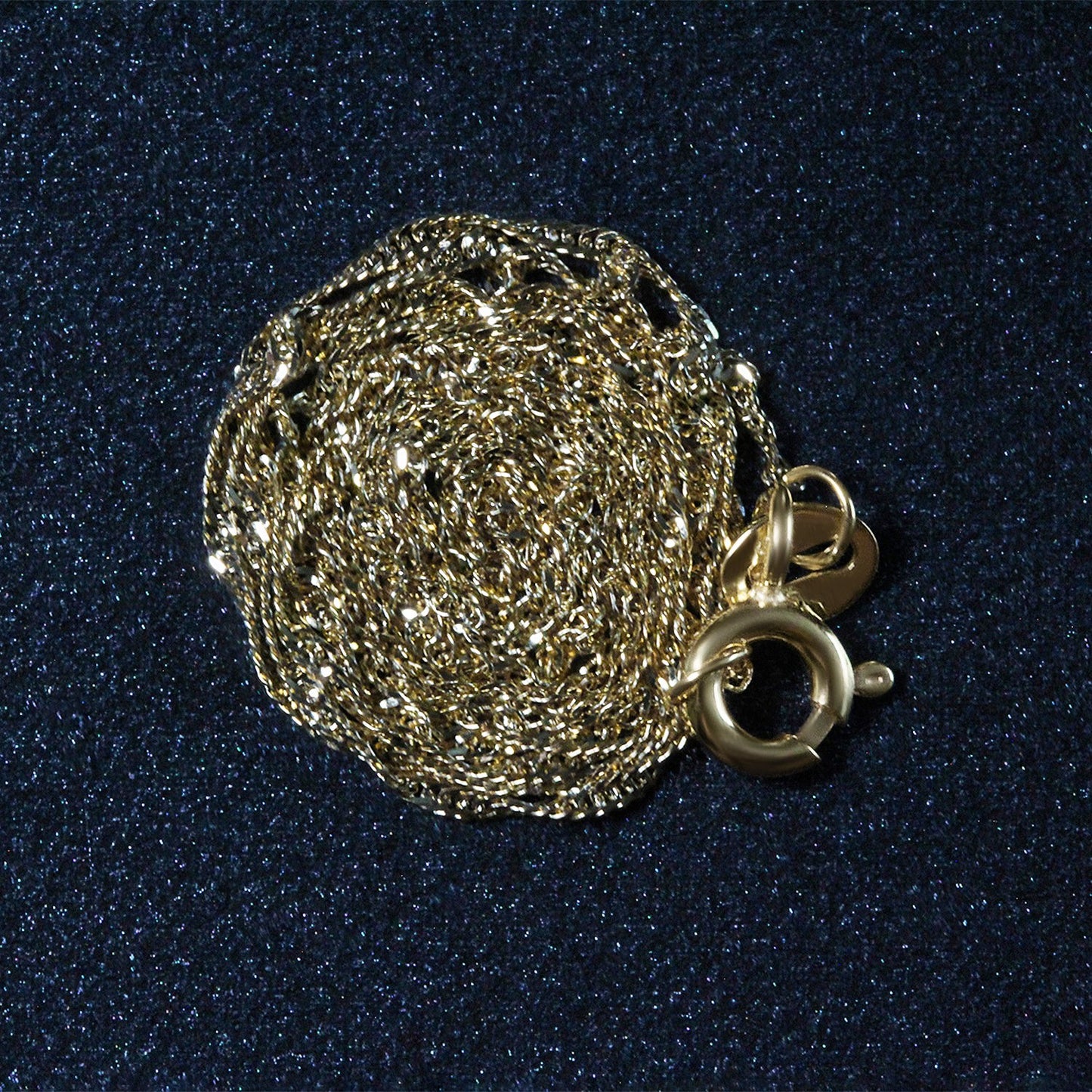 Peelerie jewelry piece in gold midnight luxury editorial product photo, high-contrast studio lighting