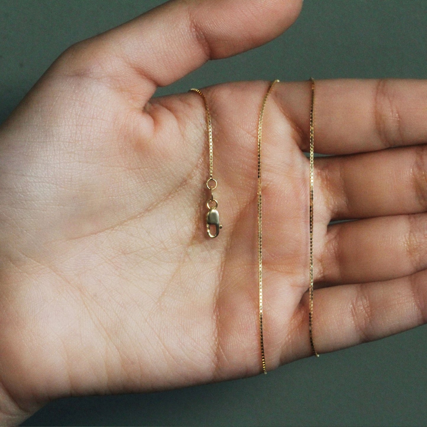 Peelerie jewelry piece in midnight luxury editorial product photo, high-contrast studio lighting