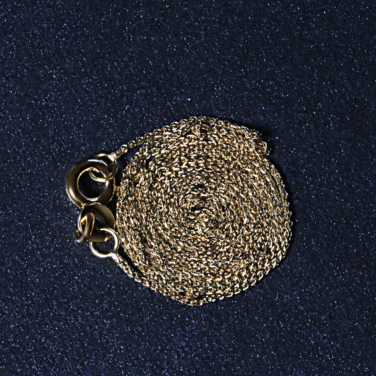 Peelerie jewelry piece in midnight luxury editorial product photo, high-contrast studio lighting