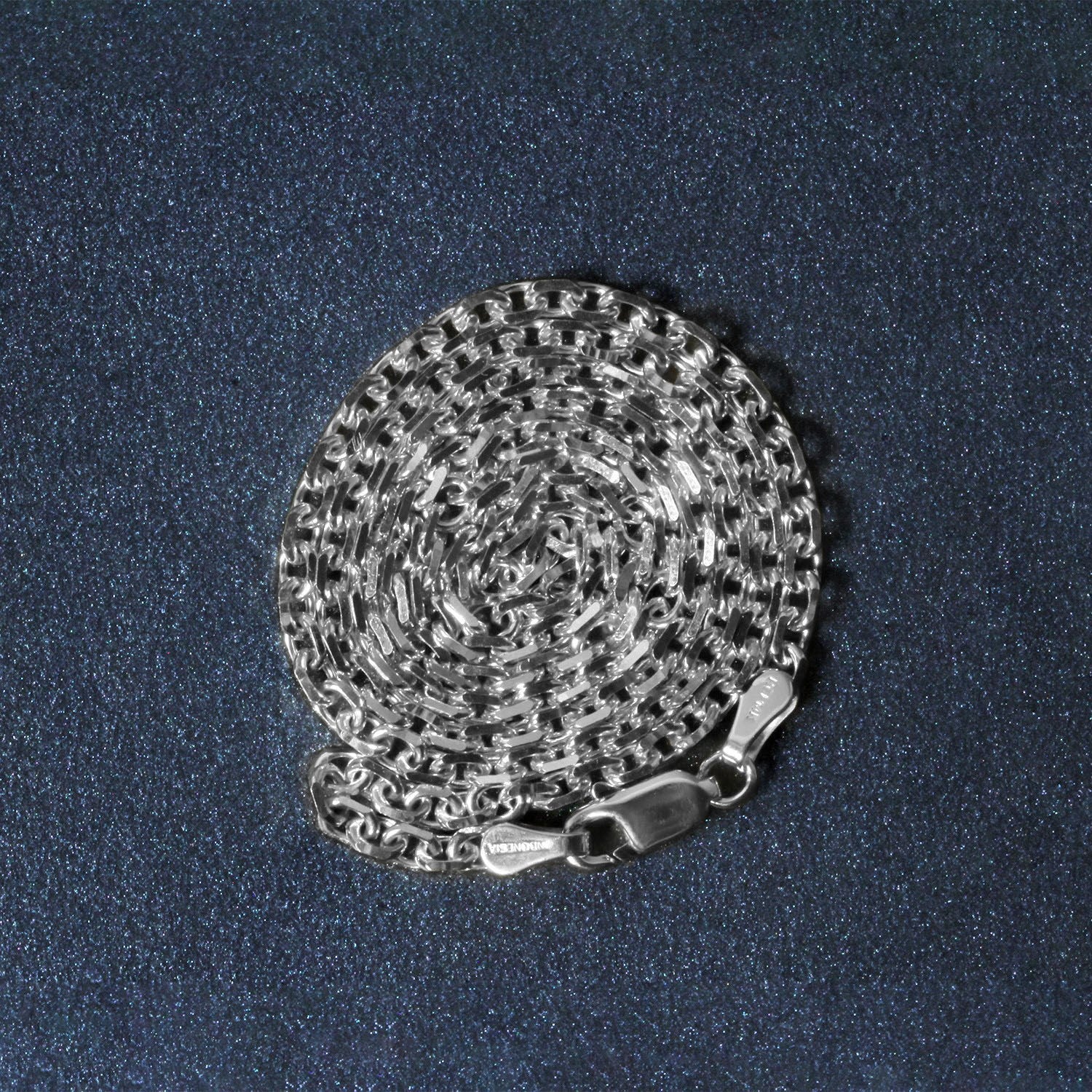 Peelerie jewelry piece in midnight luxury editorial product photo, high-contrast studio lighting