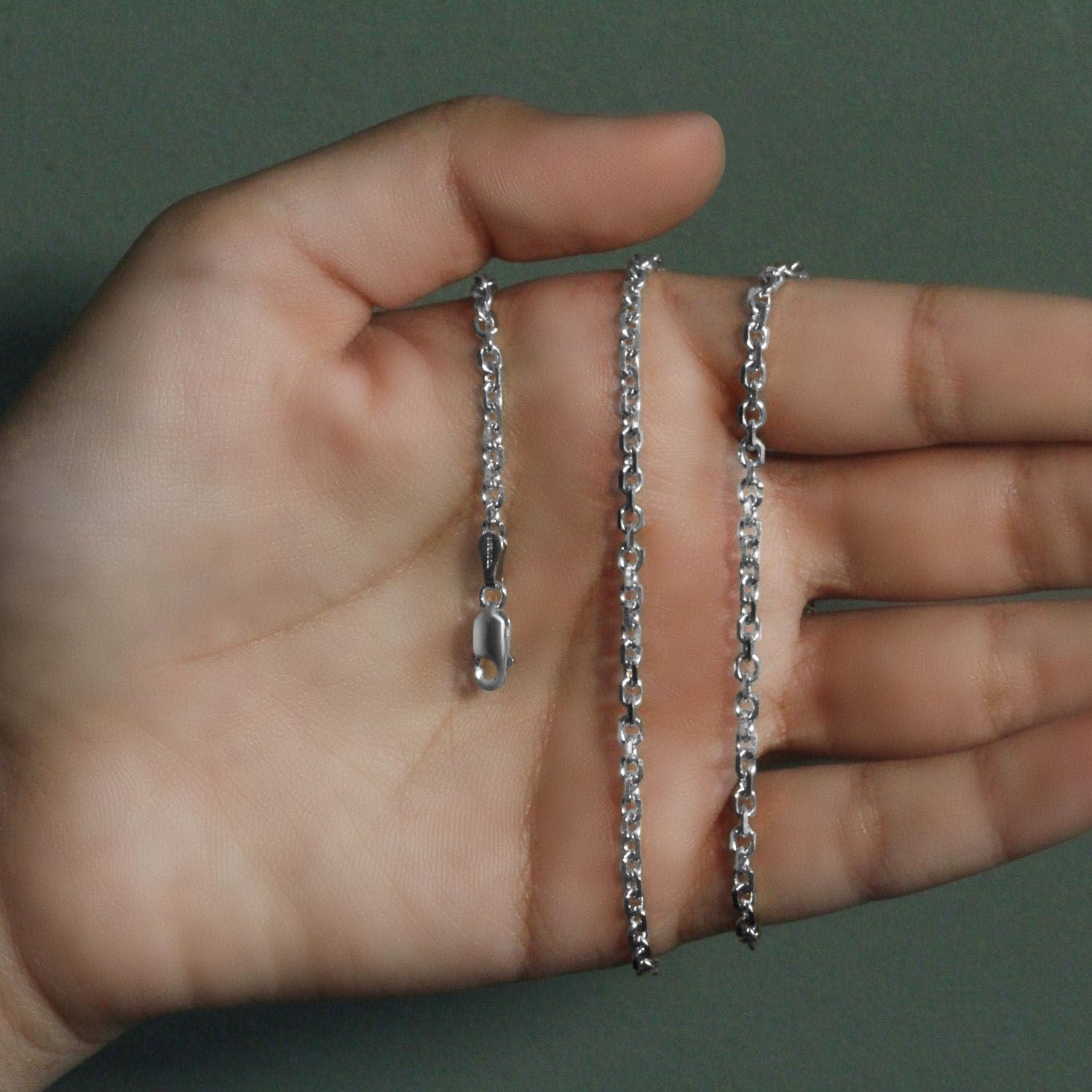 Peelerie jewelry piece in midnight luxury editorial product photo, high-contrast studio lighting