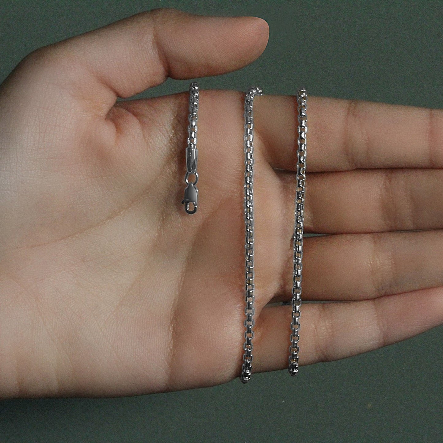 Peelerie jewelry piece in midnight luxury editorial product photo, high-contrast studio lighting