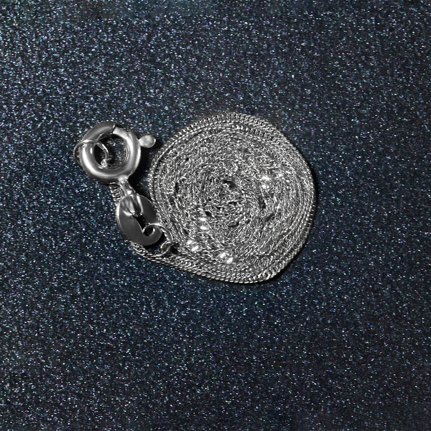 Peelerie jewelry piece in midnight luxury editorial product photo, high-contrast studio lighting