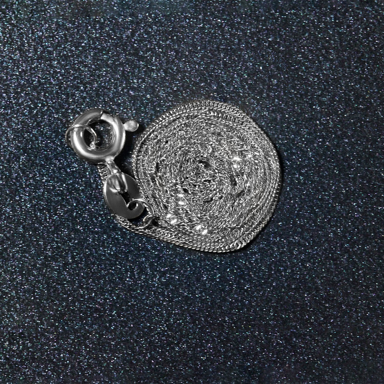 Peelerie jewelry piece in midnight luxury editorial product photo, high-contrast studio lighting