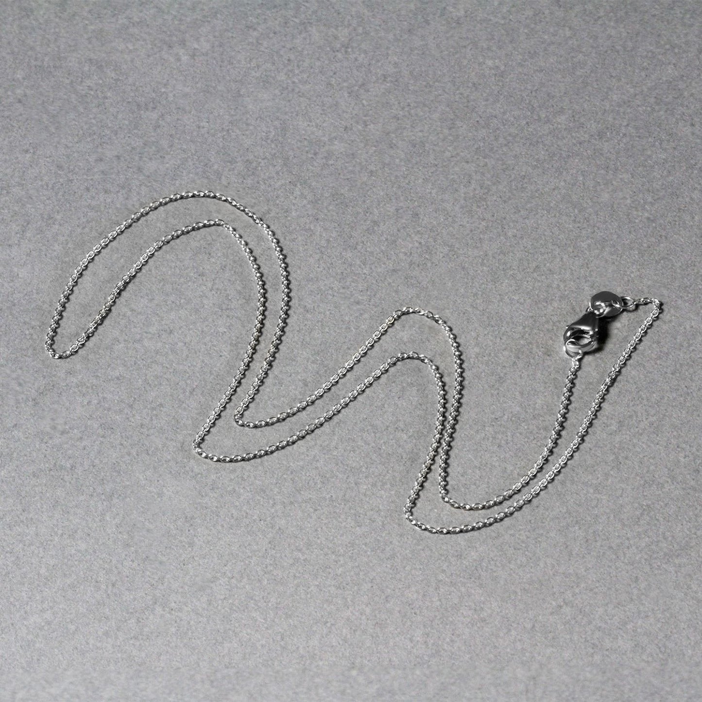 Peelerie jewelry piece in midnight luxury editorial product photo, high-contrast studio lighting