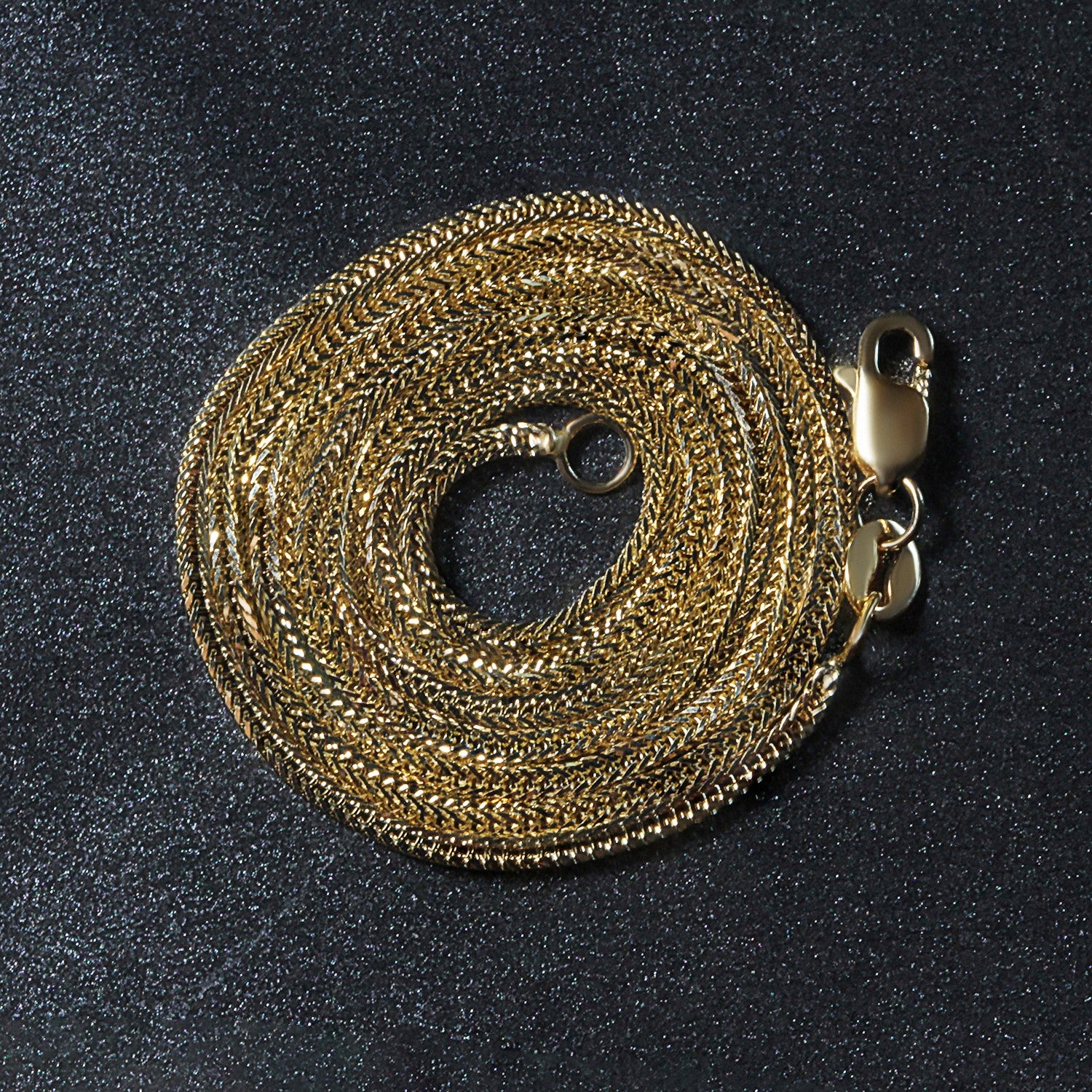 Peelerie jewelry piece in midnight luxury editorial product photo, high-contrast studio lighting