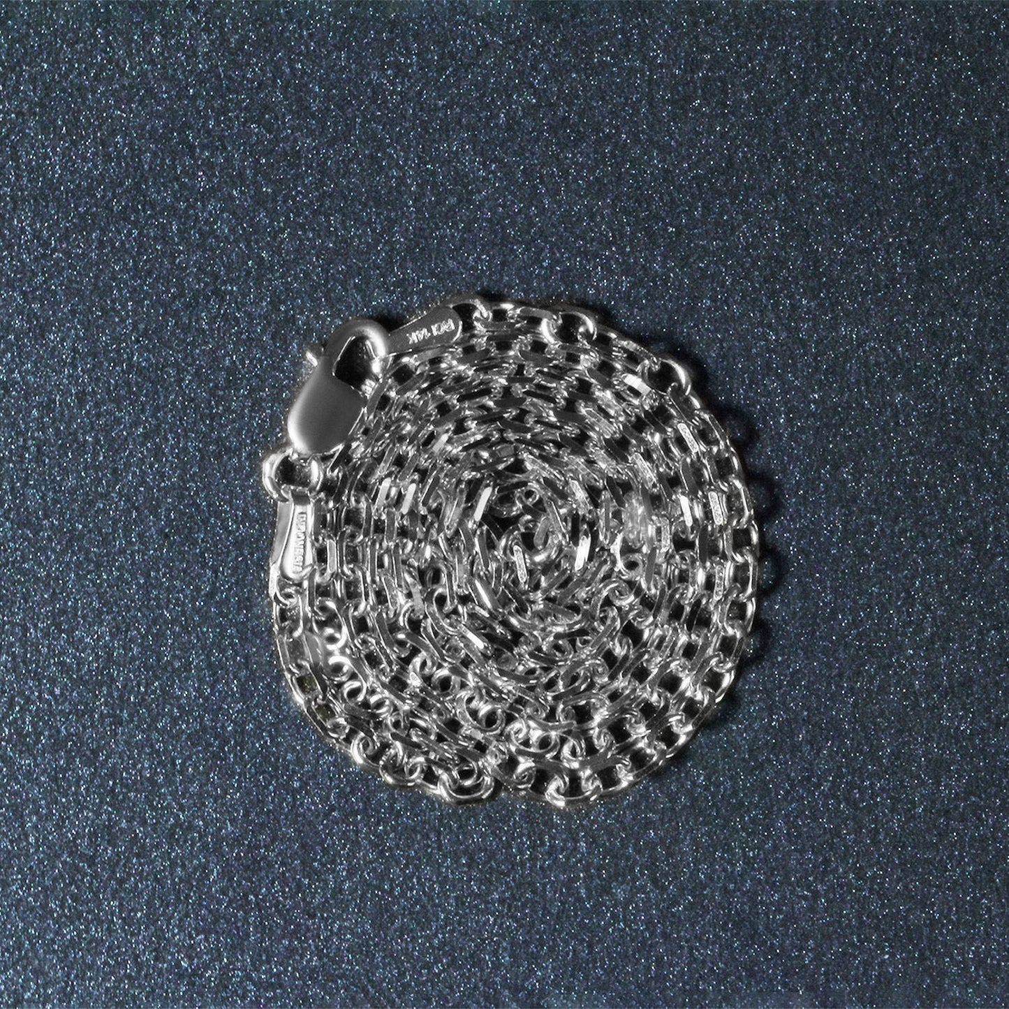 Peelerie jewelry piece in midnight luxury editorial product photo, high-contrast studio lighting