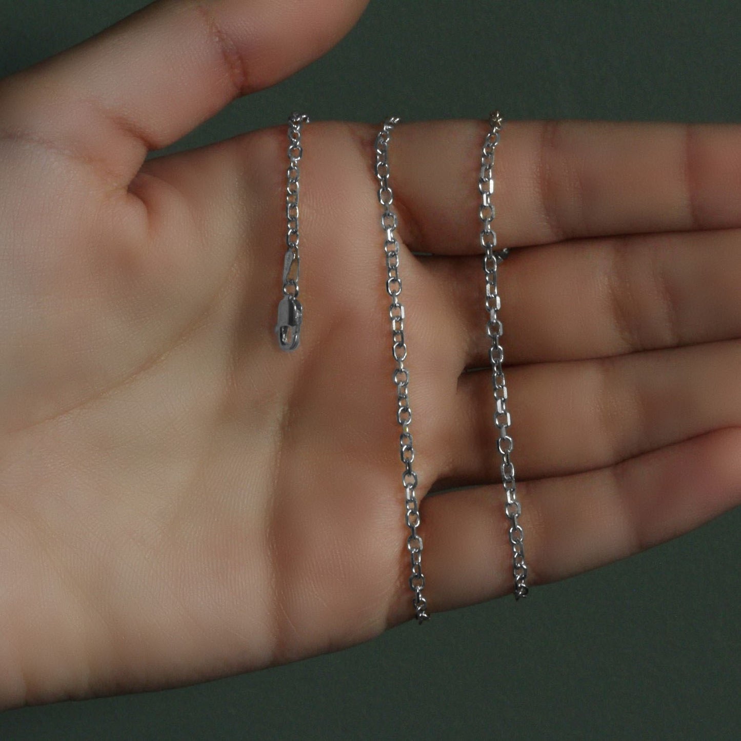 Peelerie jewelry piece in midnight luxury editorial product photo, high-contrast studio lighting