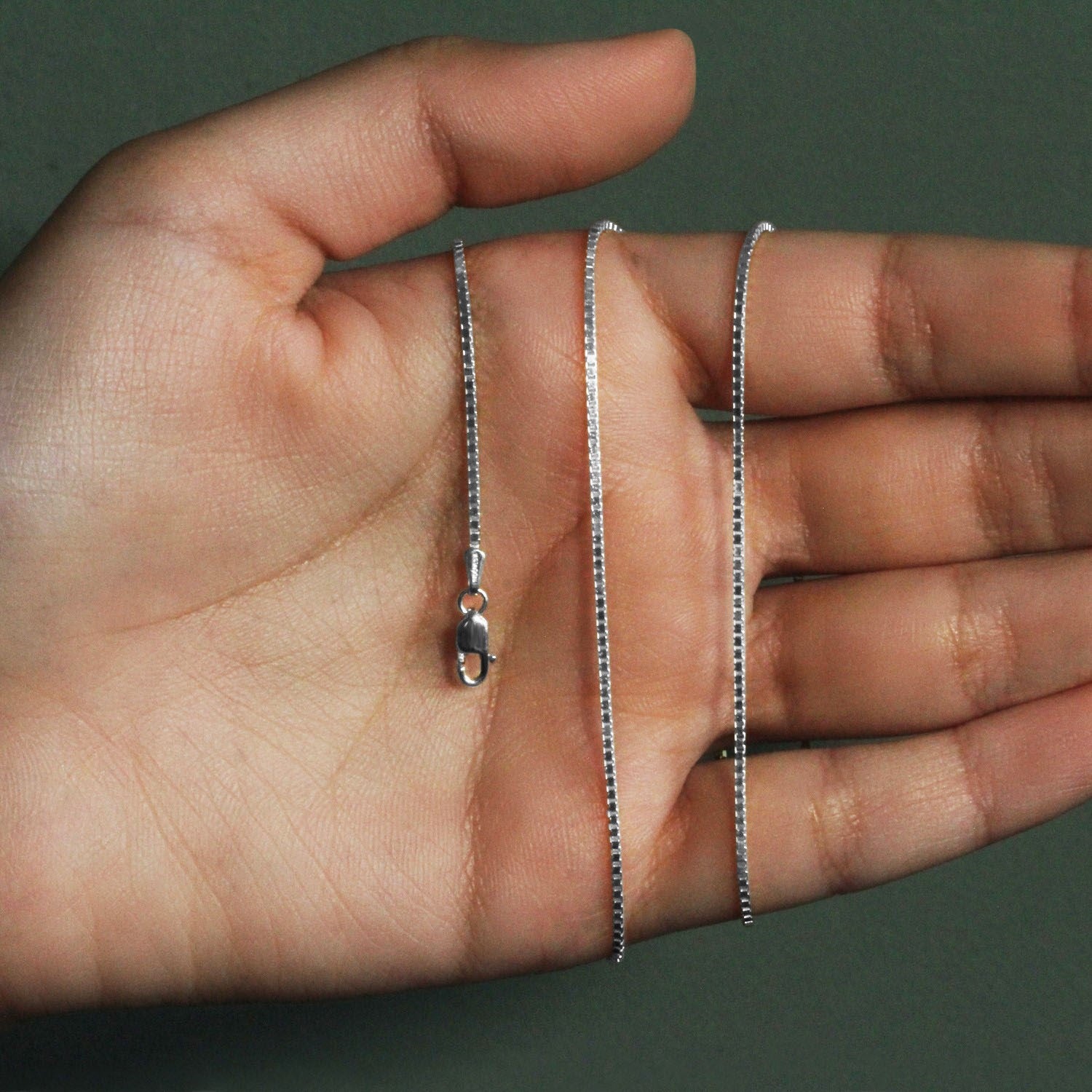 Peelerie jewelry piece in midnight luxury editorial product photo, high-contrast studio lighting