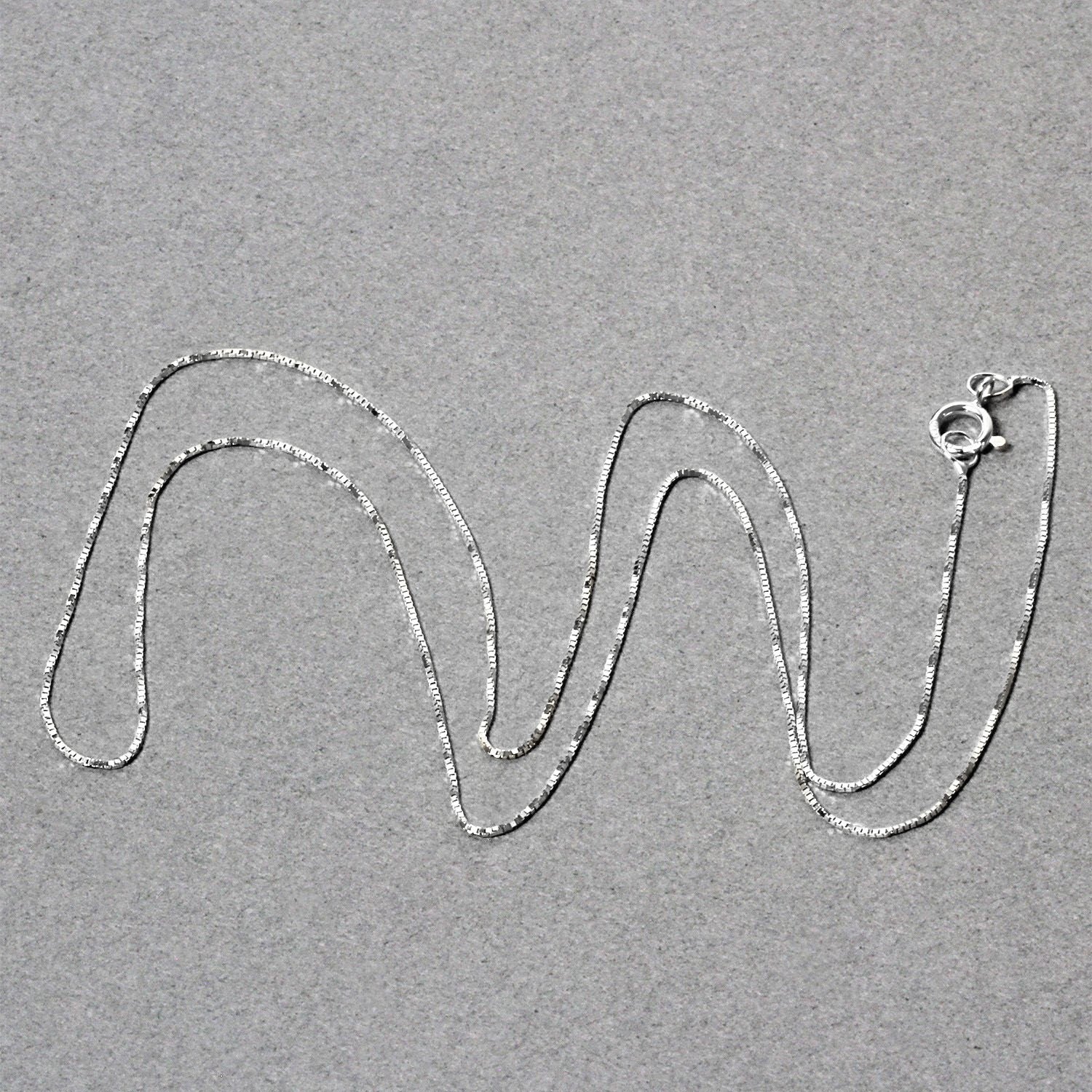 Peelerie jewelry piece in midnight luxury editorial product photo, high-contrast studio lighting