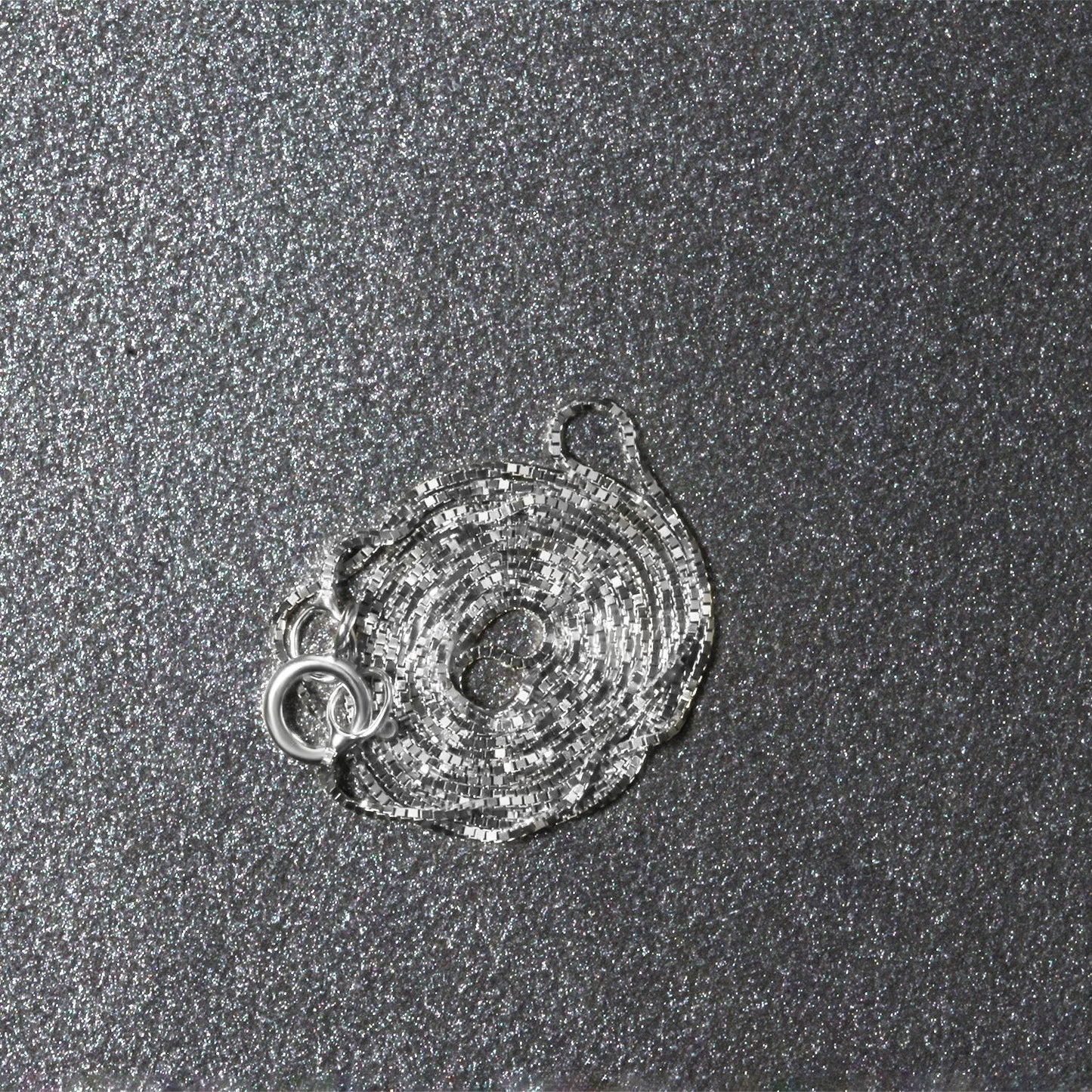 Peelerie jewelry piece in midnight luxury editorial product photo, high-contrast studio lighting