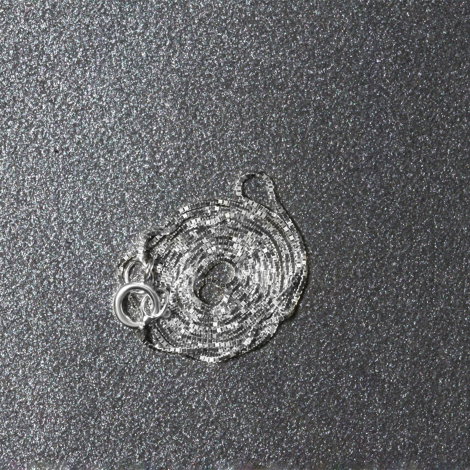 Peelerie jewelry piece in midnight luxury editorial product photo, high-contrast studio lighting