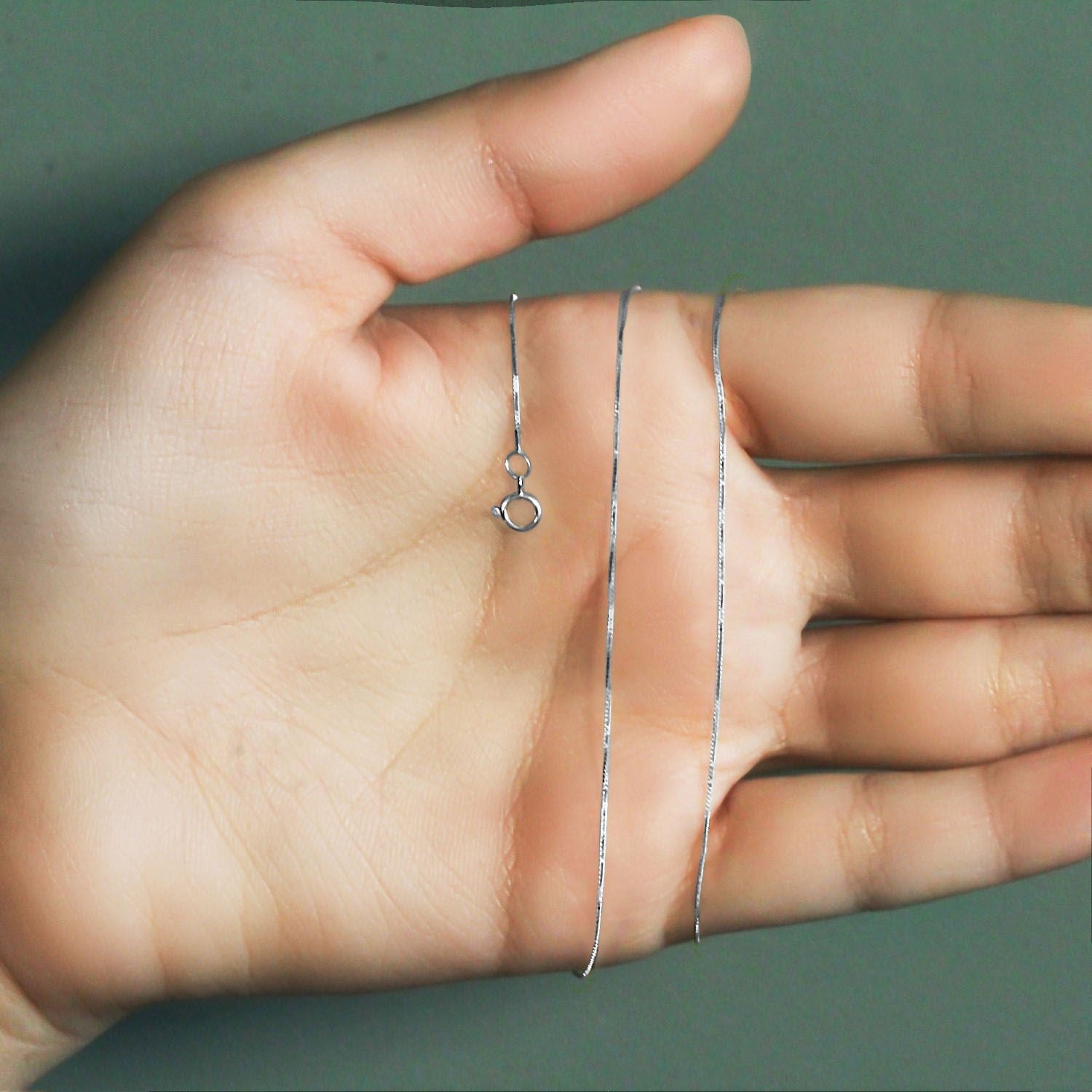 Peelerie jewelry piece in midnight luxury editorial product photo, high-contrast studio lighting