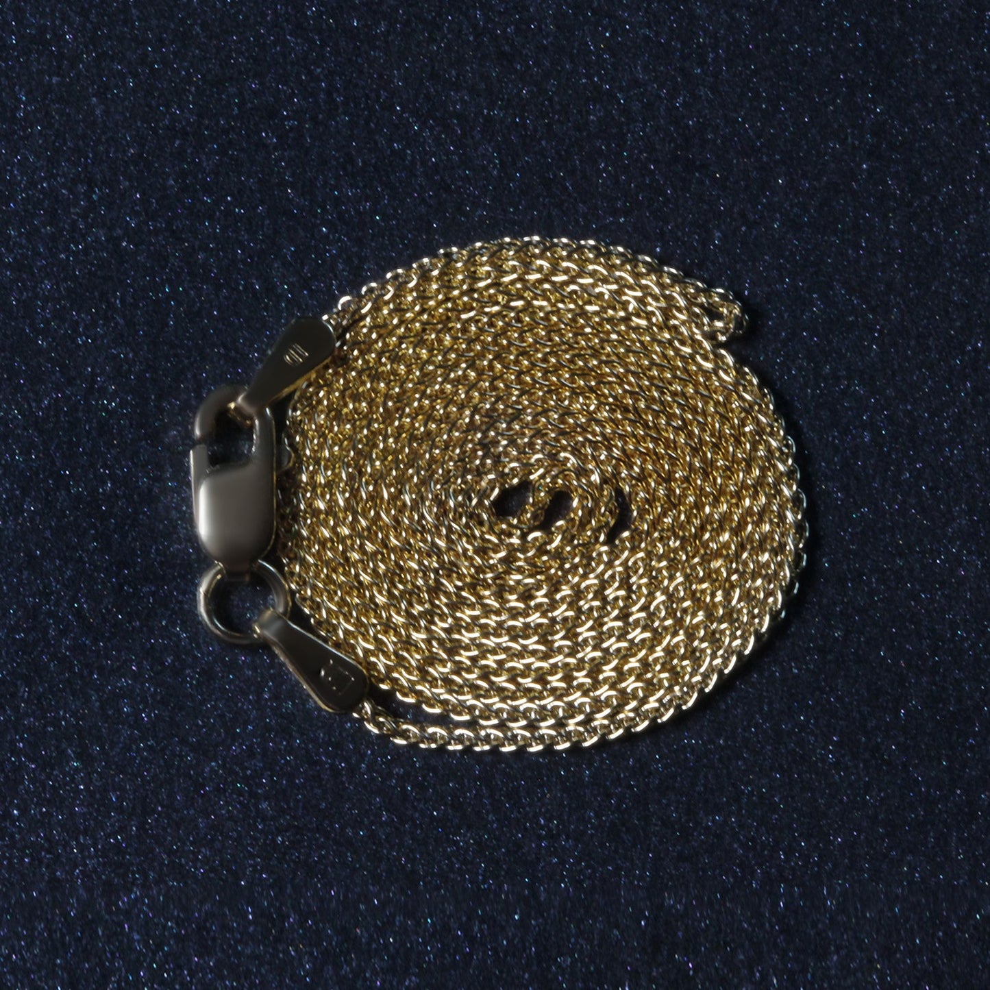 Peelerie jewelry piece in midnight luxury editorial product photo, high-contrast studio lighting