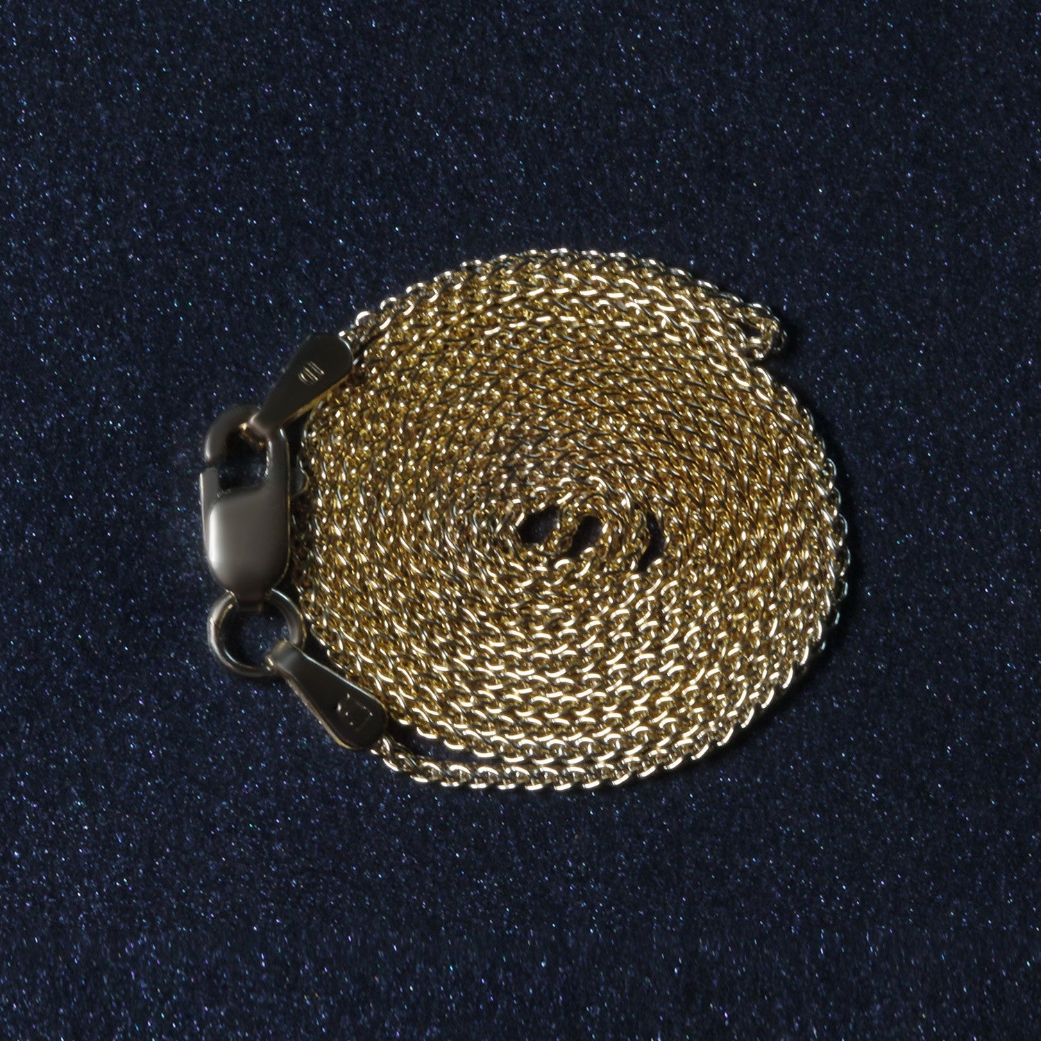 Peelerie jewelry piece in midnight luxury editorial product photo, high-contrast studio lighting