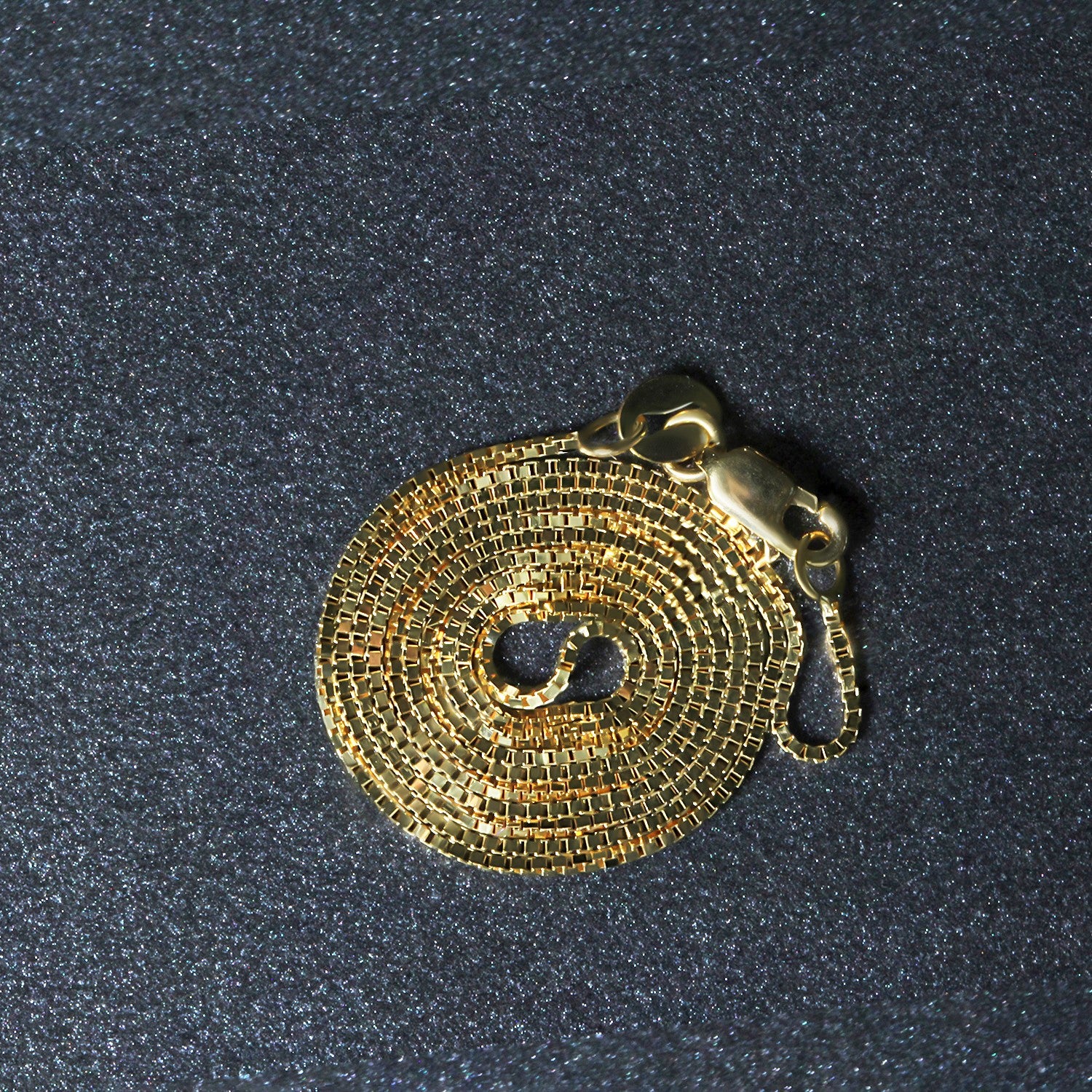 Peelerie jewelry piece in midnight luxury editorial product photo, high-contrast studio lighting