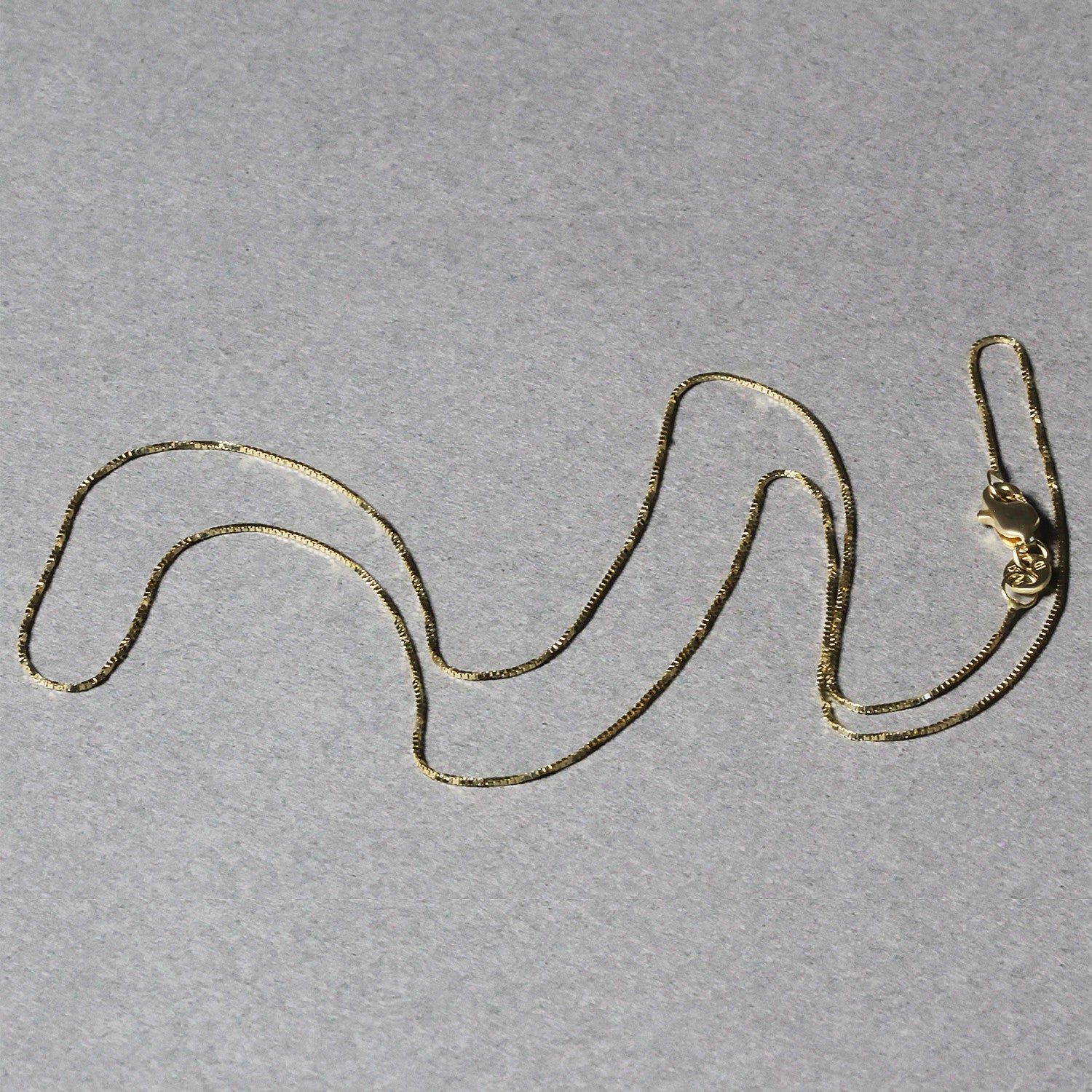 Peelerie jewelry piece in midnight luxury editorial product photo, high-contrast studio lighting