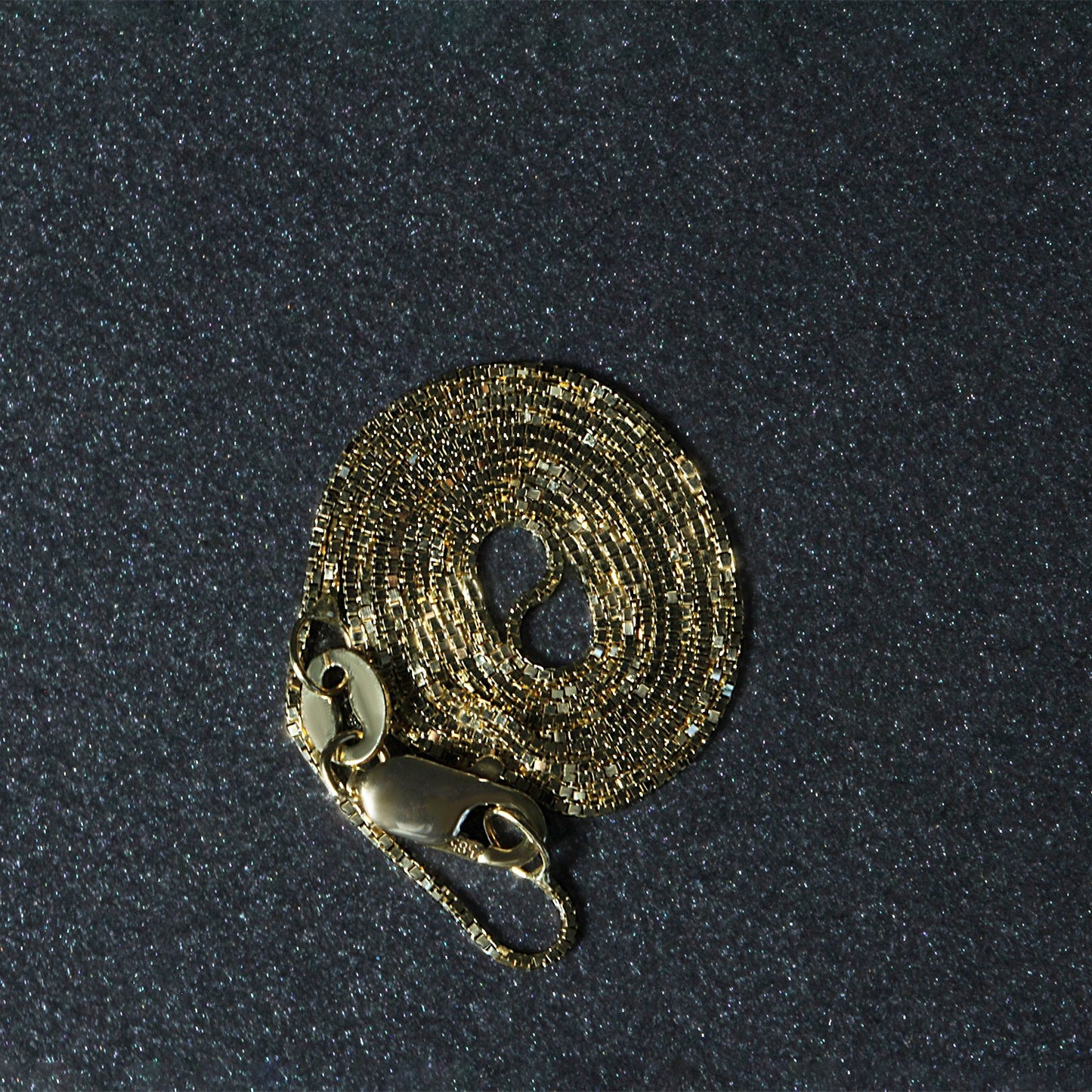 Peelerie jewelry piece in midnight luxury editorial product photo, high-contrast studio lighting