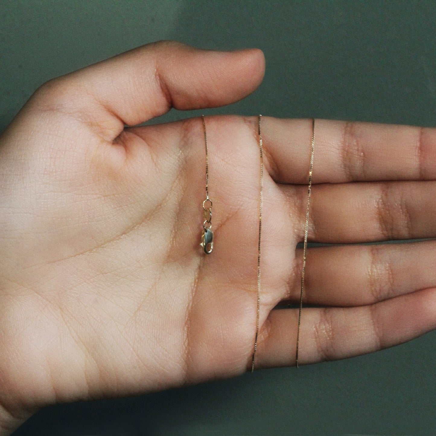 Peelerie jewelry piece in midnight luxury editorial product photo, high-contrast studio lighting