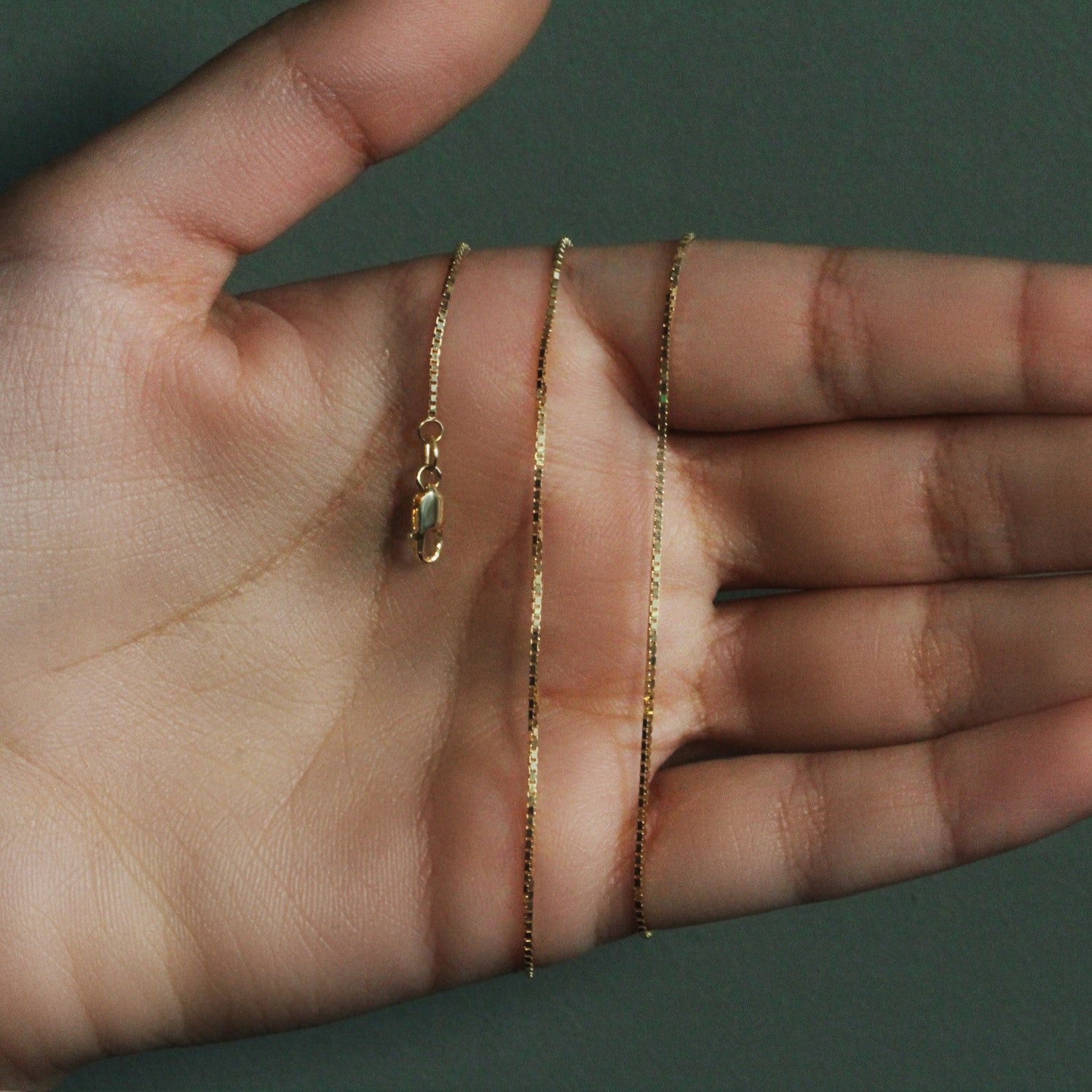 Peelerie jewelry piece in midnight luxury editorial product photo, high-contrast studio lighting