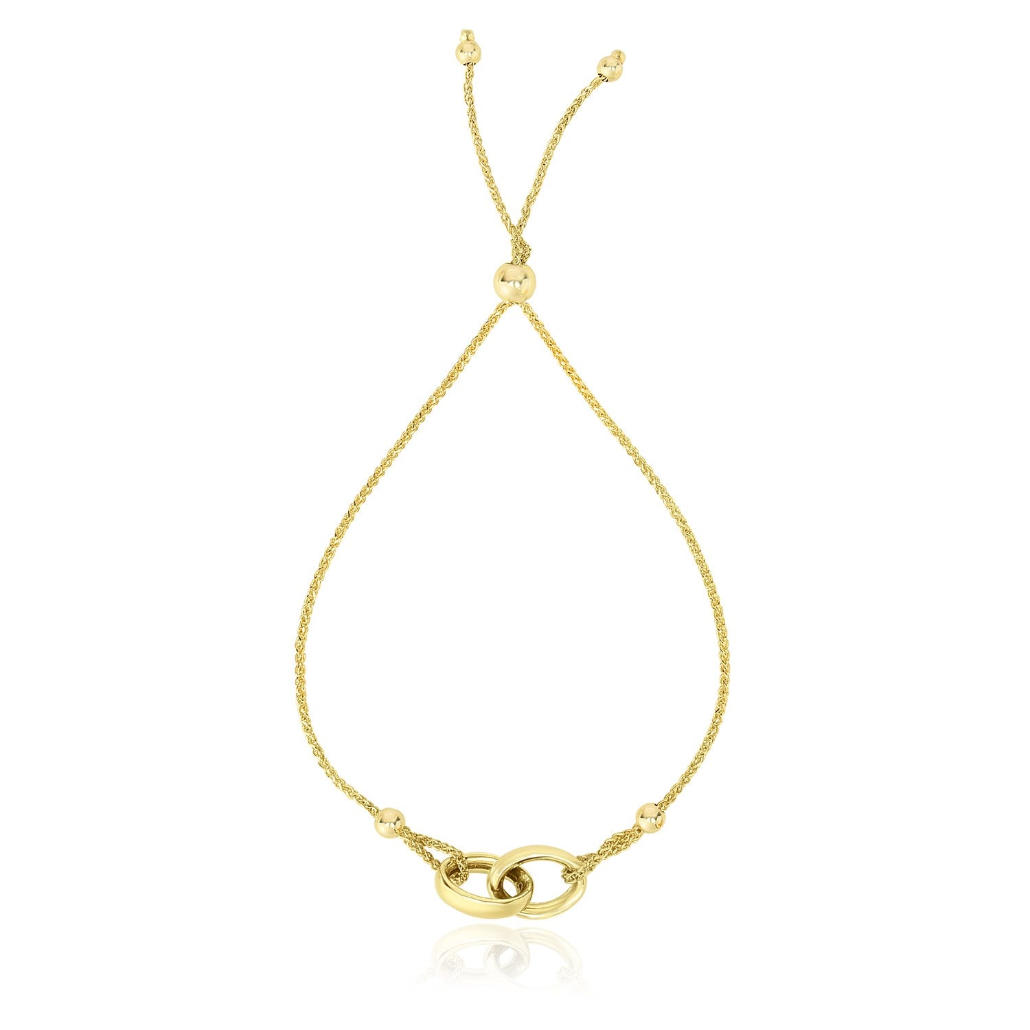 14k Yellow Gold Entwined Rings Adjustable Lariat Style Bracelet in a sleek high-contrast midnight luxury editorial style