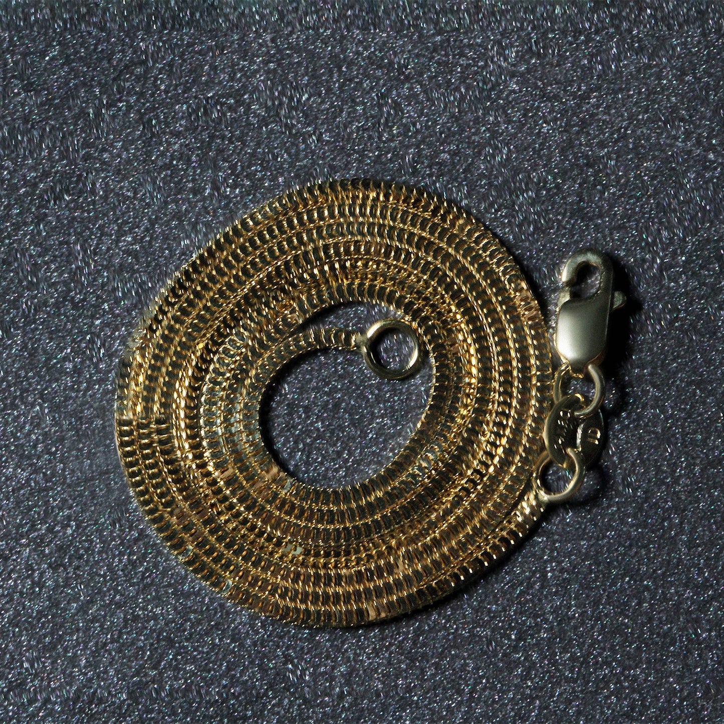 Peelerie jewelry piece in midnight luxury editorial product photo, high-contrast studio lighting