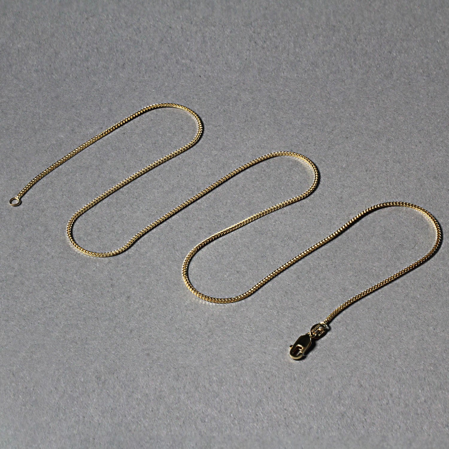 Peelerie jewelry piece in midnight luxury editorial product photo, high-contrast studio lighting