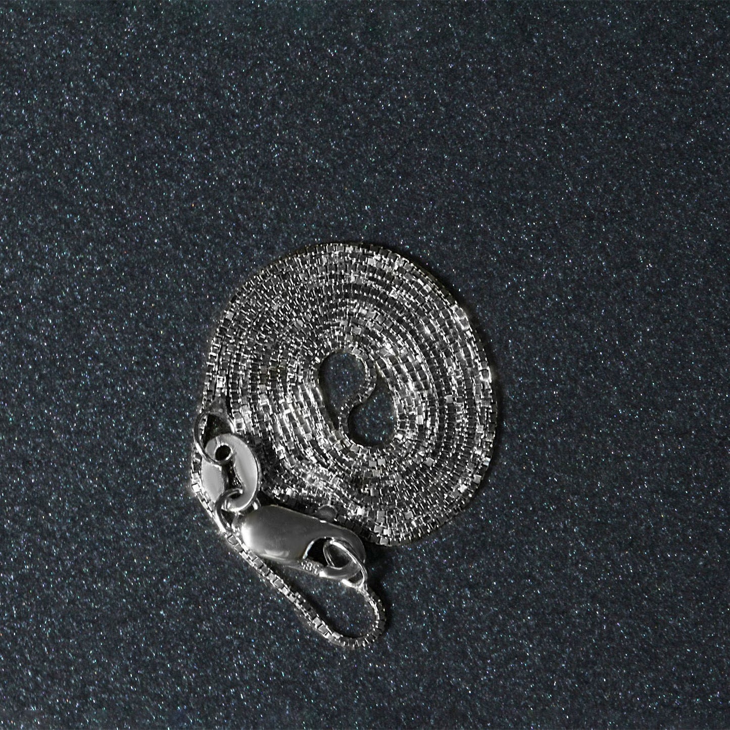 Peelerie jewelry piece in midnight luxury editorial product photo, high-contrast studio lighting