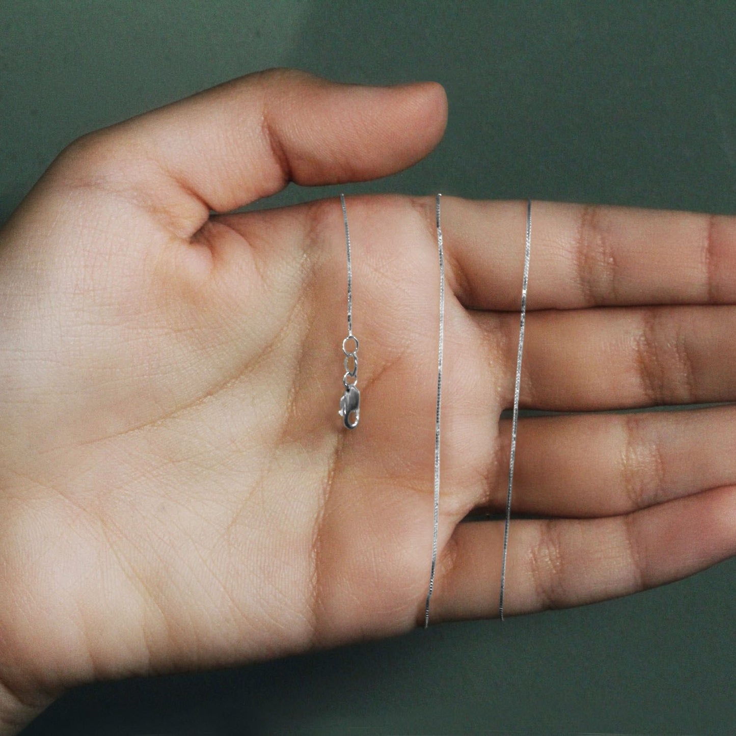 Peelerie jewelry piece in midnight luxury editorial product photo, high-contrast studio lighting