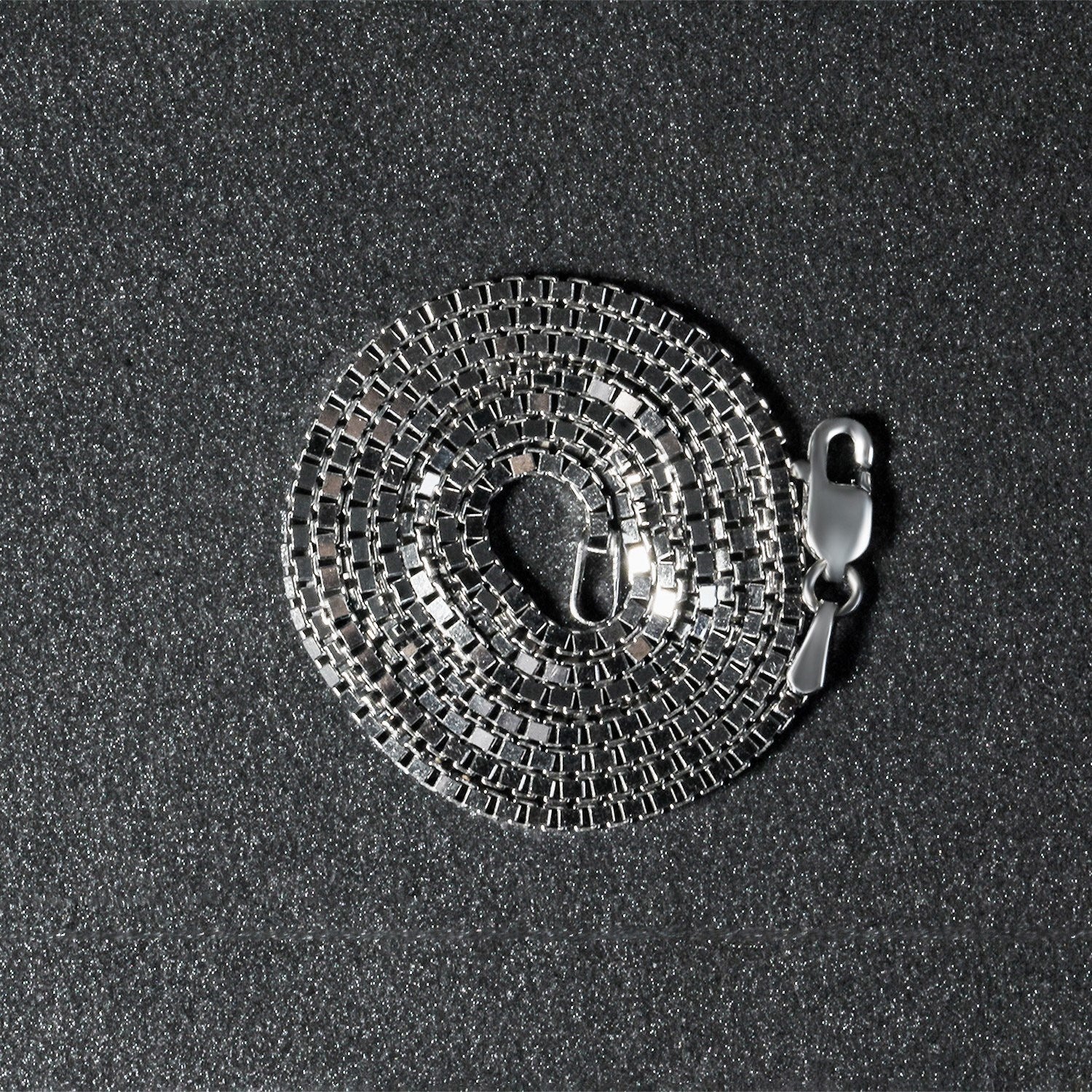 Peelerie jewelry piece in midnight luxury editorial product photo, high-contrast studio lighting