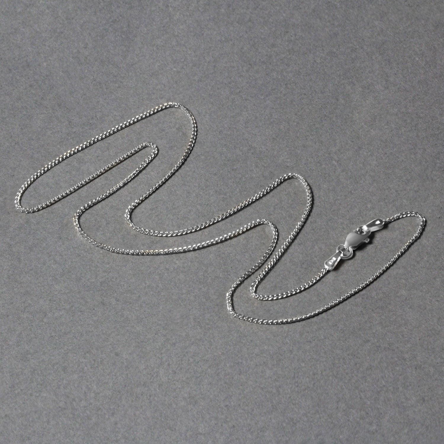 Peelerie jewelry piece in midnight luxury editorial product photo, high-contrast studio lighting