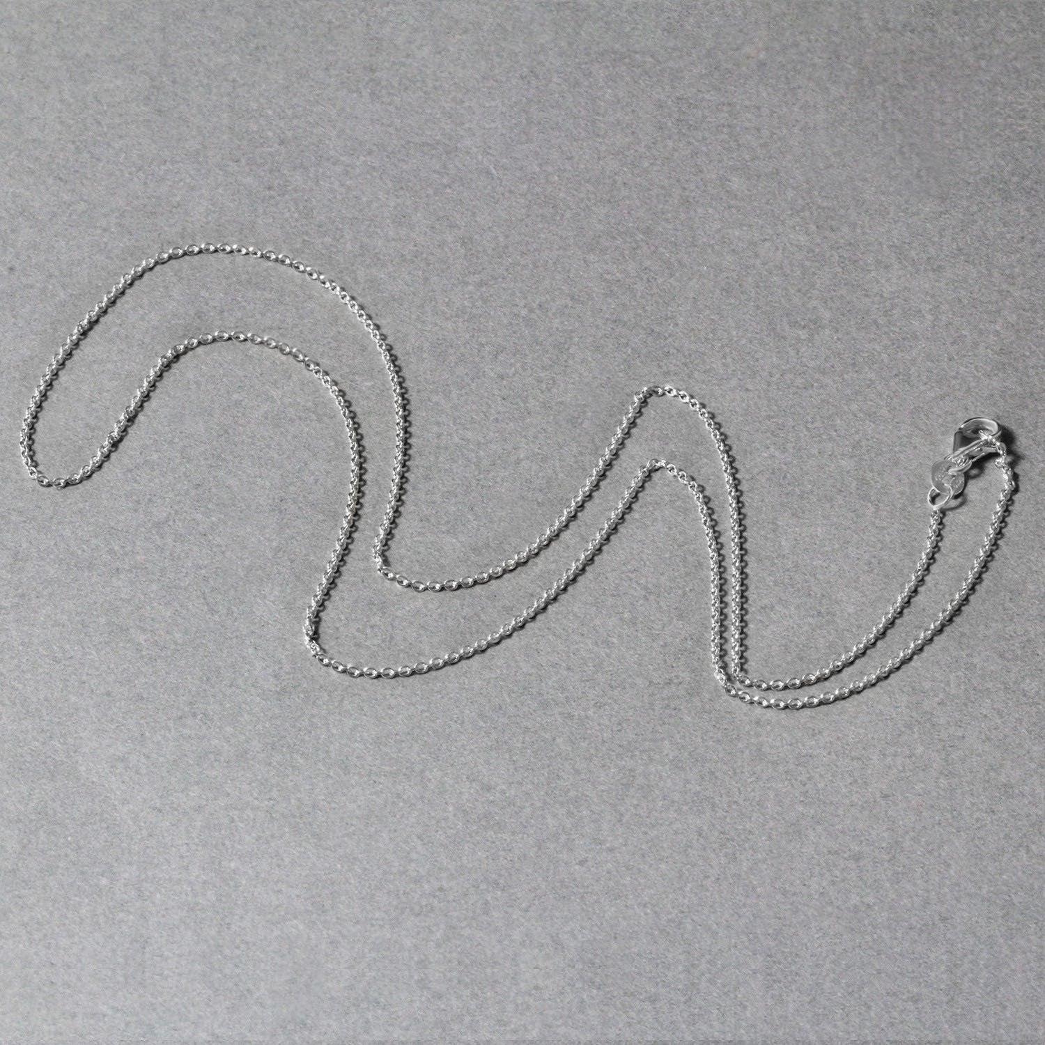 Peelerie jewelry piece in midnight luxury editorial product photo, high-contrast studio lighting