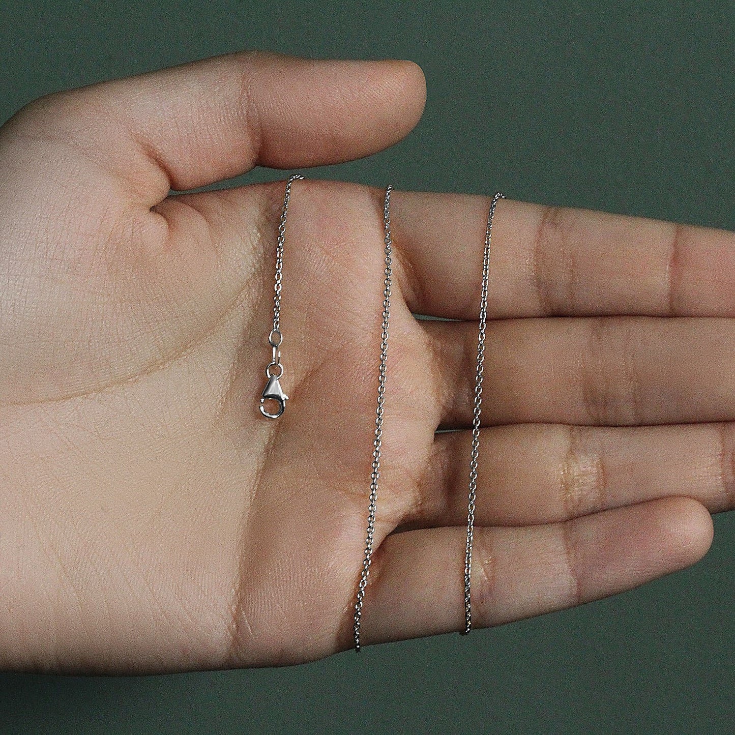 Peelerie jewelry piece in midnight luxury editorial product photo, high-contrast studio lighting