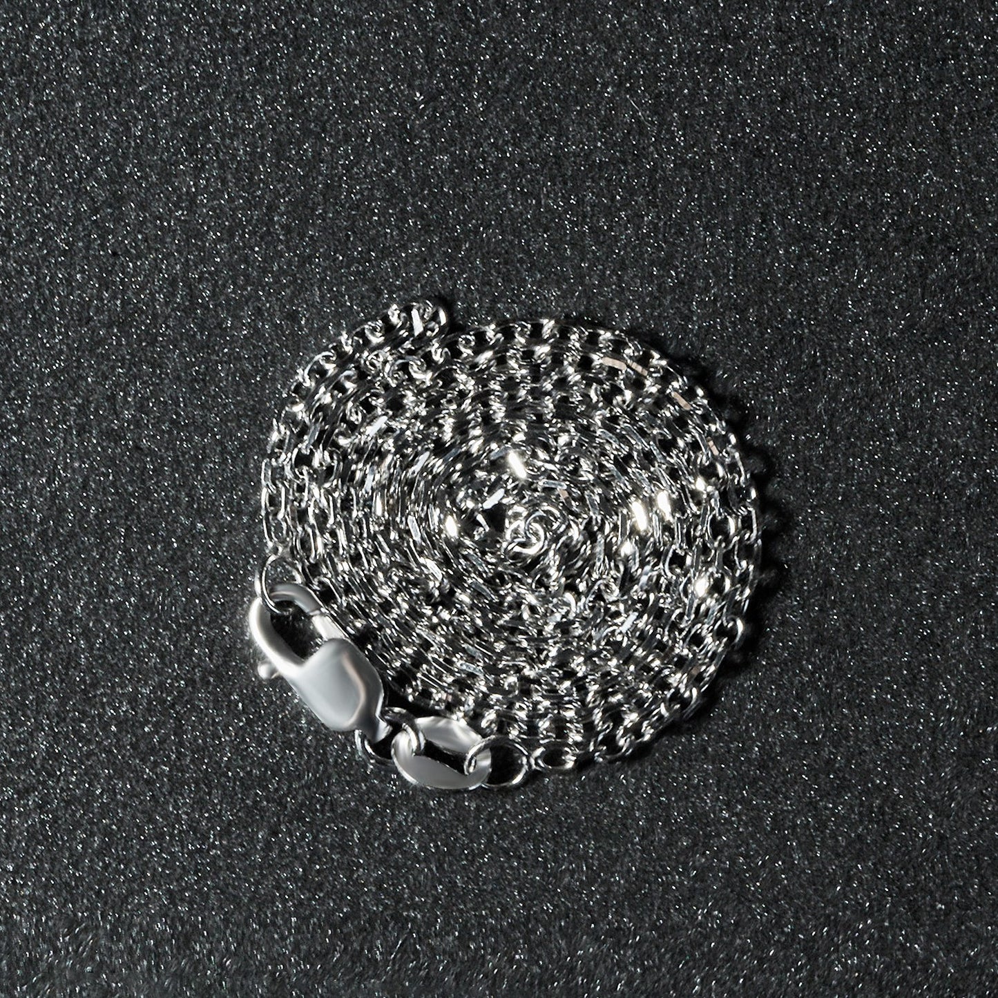 Peelerie jewelry piece in midnight luxury editorial product photo, high-contrast studio lighting